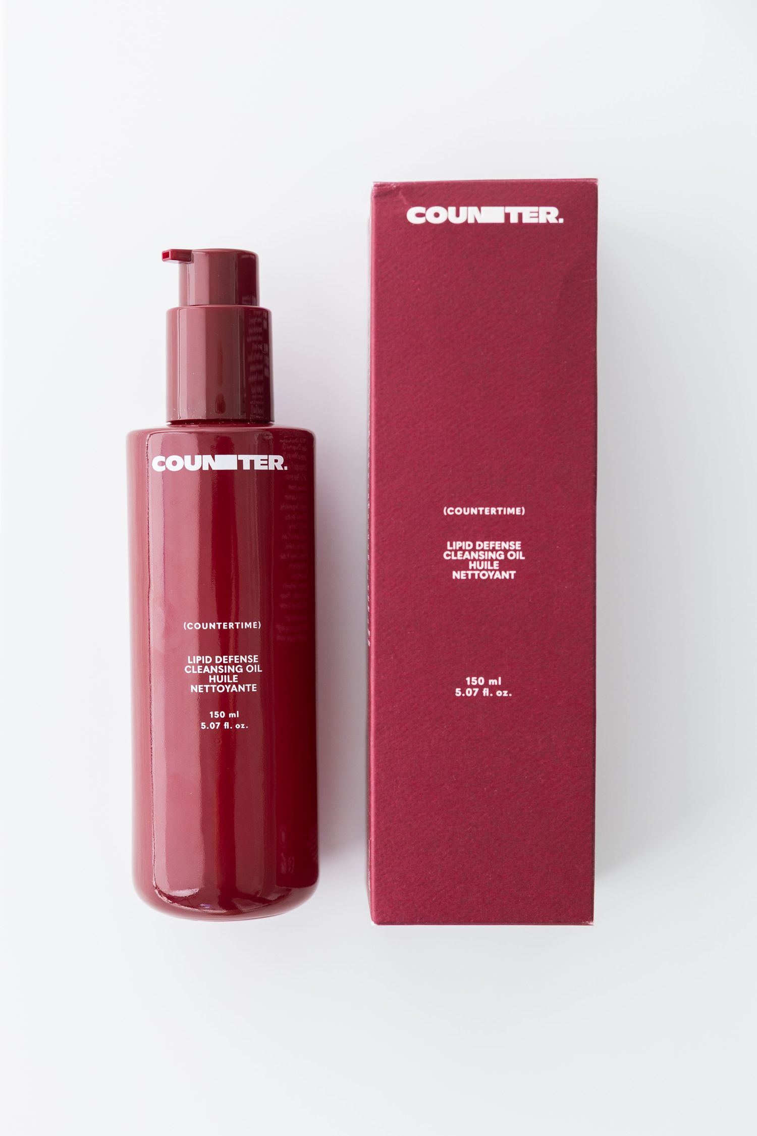 Red beauty product bottles and packaging from Countertex brand.