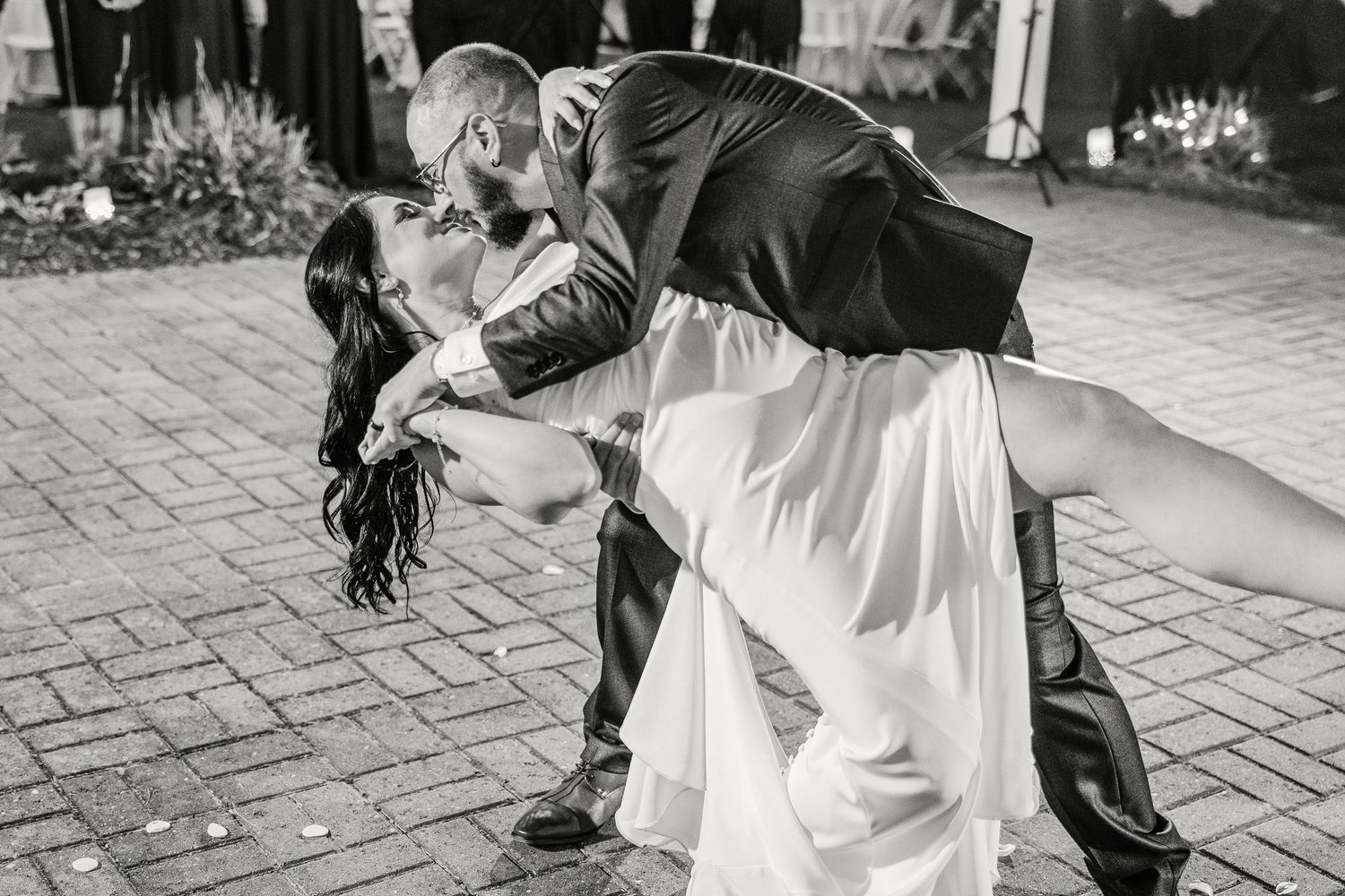 Black and white wedding dance photos on brick patio wedding groom bride lake Gaston photographer light airy