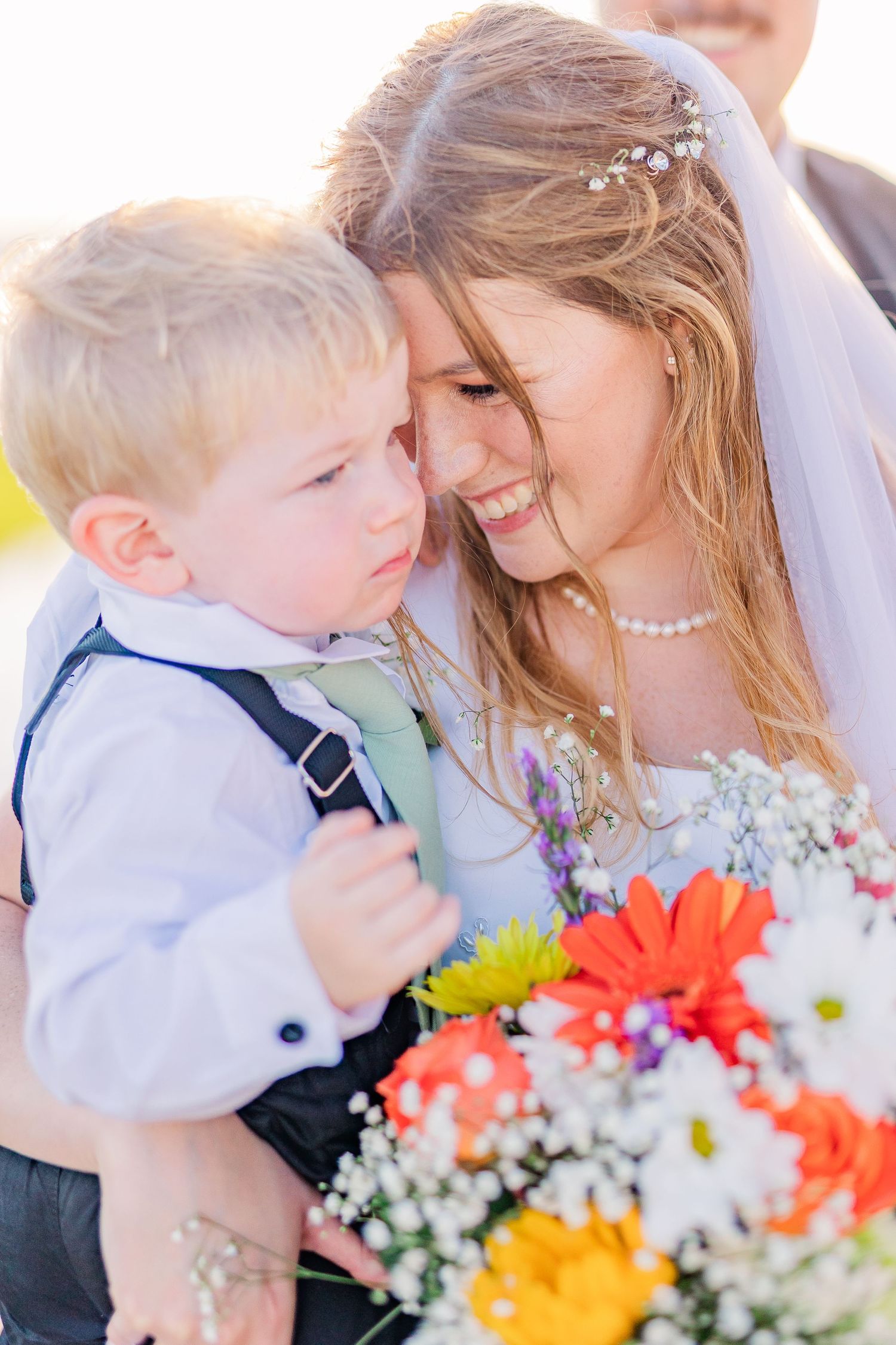 Sweet wedding moments captured with colorful summer bouquet southport elopement wedding bride groom light and airy classic