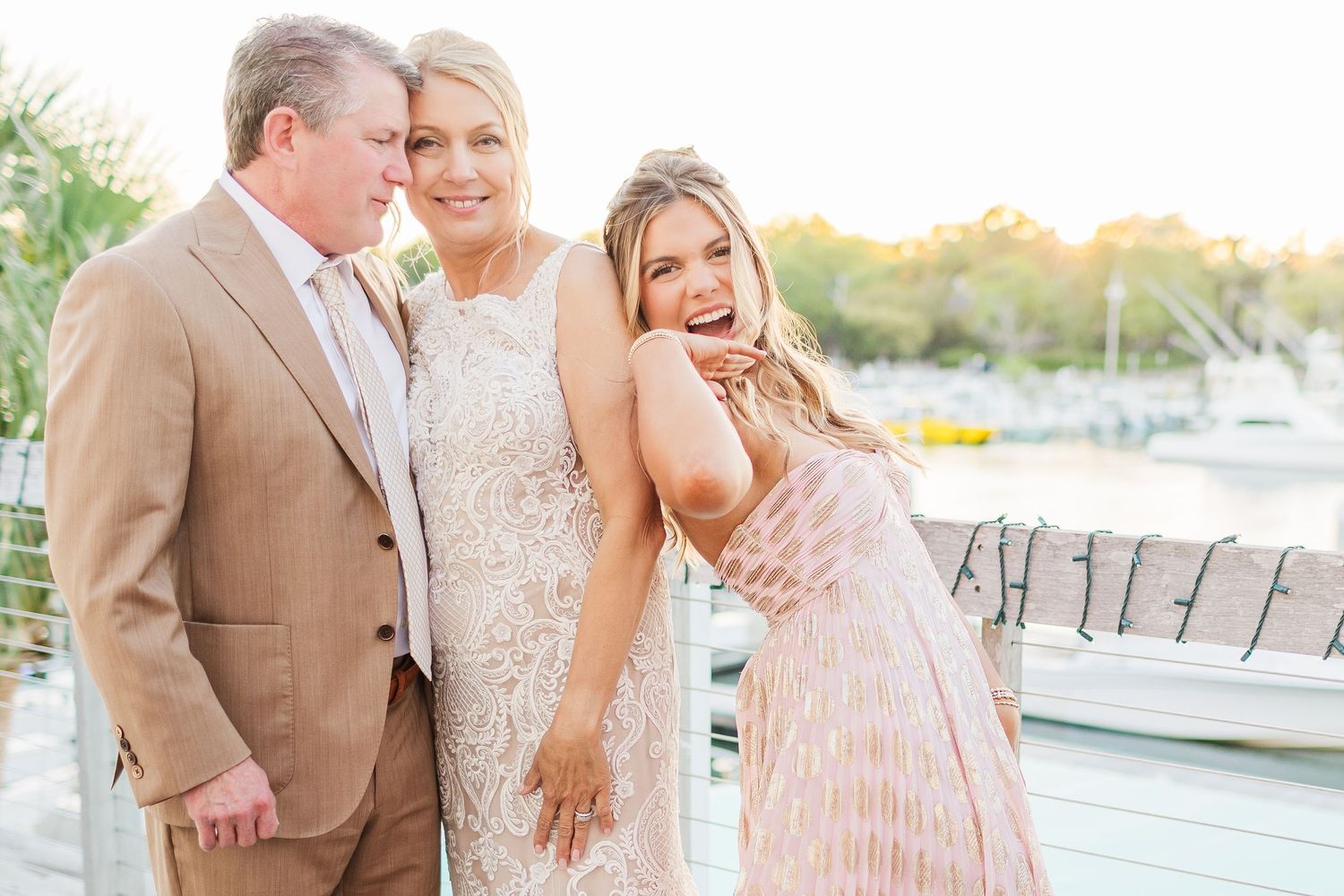 Wedding celebration on a coastal deck with joyful moments and laughter.