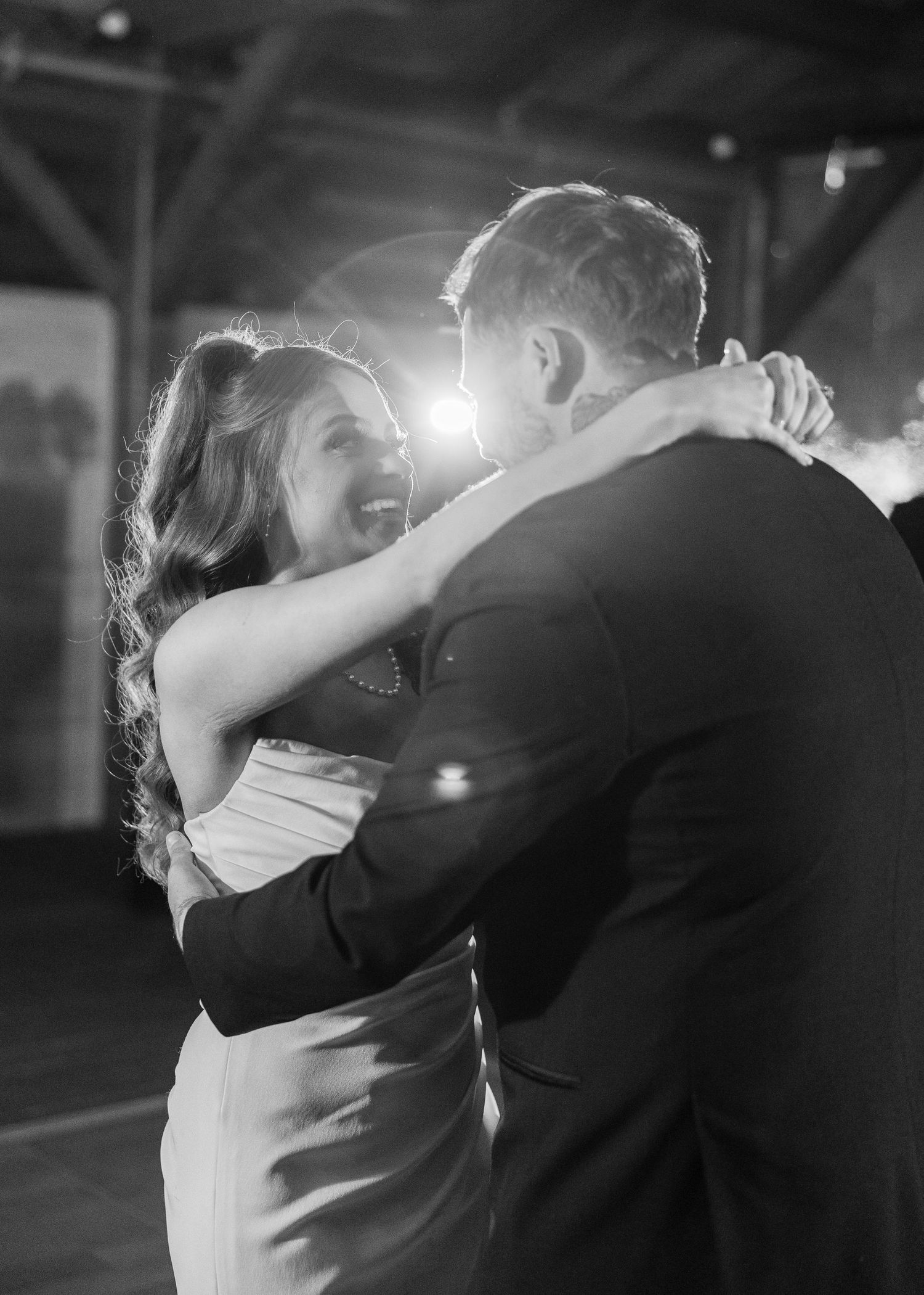 Black and white photo of a romantic first dance moment at a wedding reception wedding groom bride wilmington North Carolina photographer