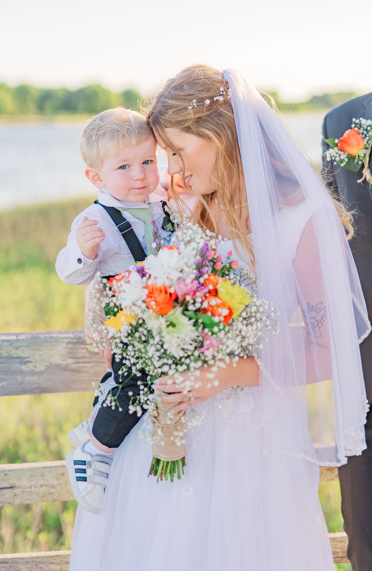 Wedding portraits featuring bright orange and white floral bouquet southport elopement wedding bride groom light and airy classic