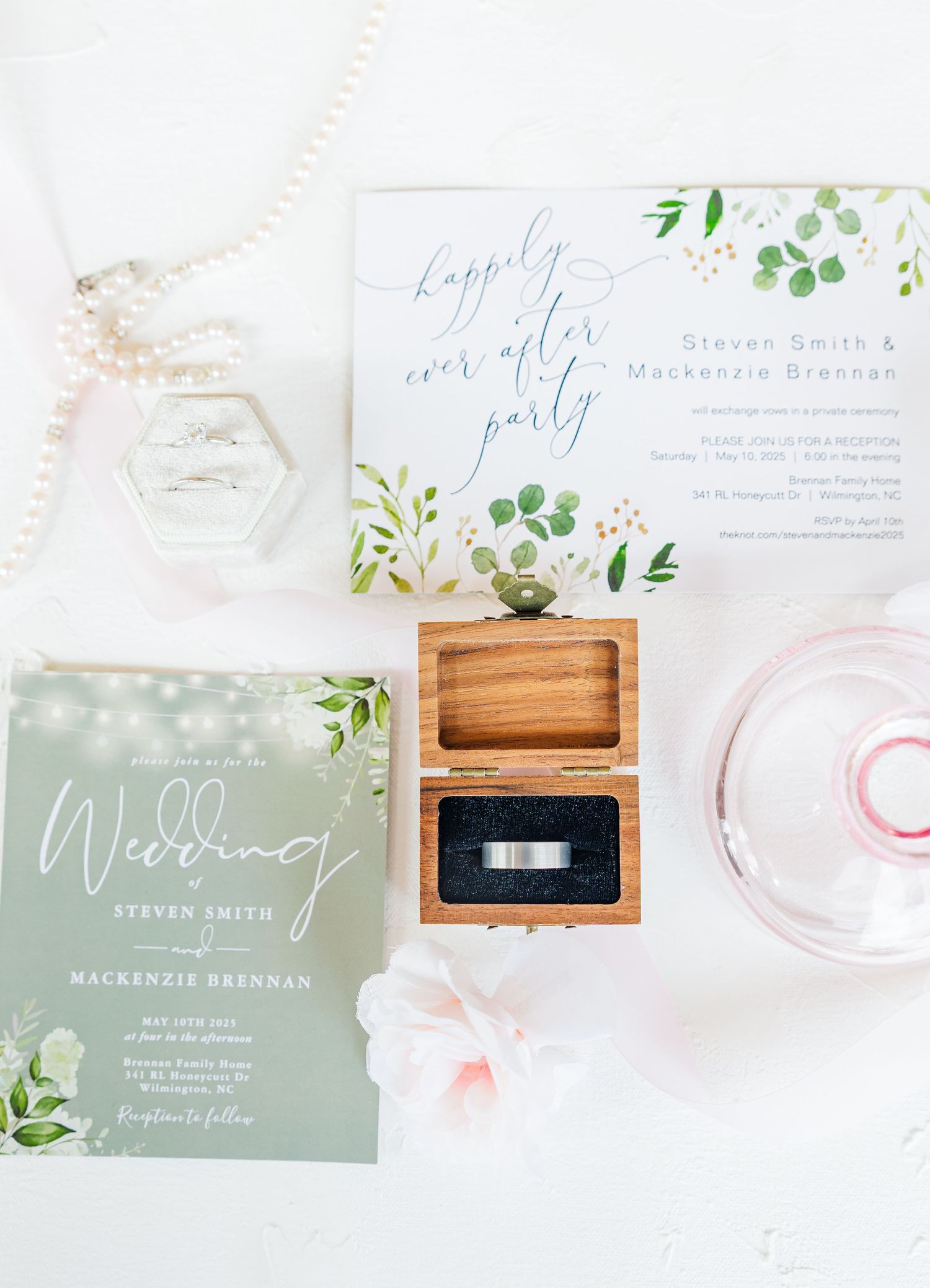 Flat lay light and airy white vow books with memory card box on peach background wedding groom bride wilmington North Carolina photographer
