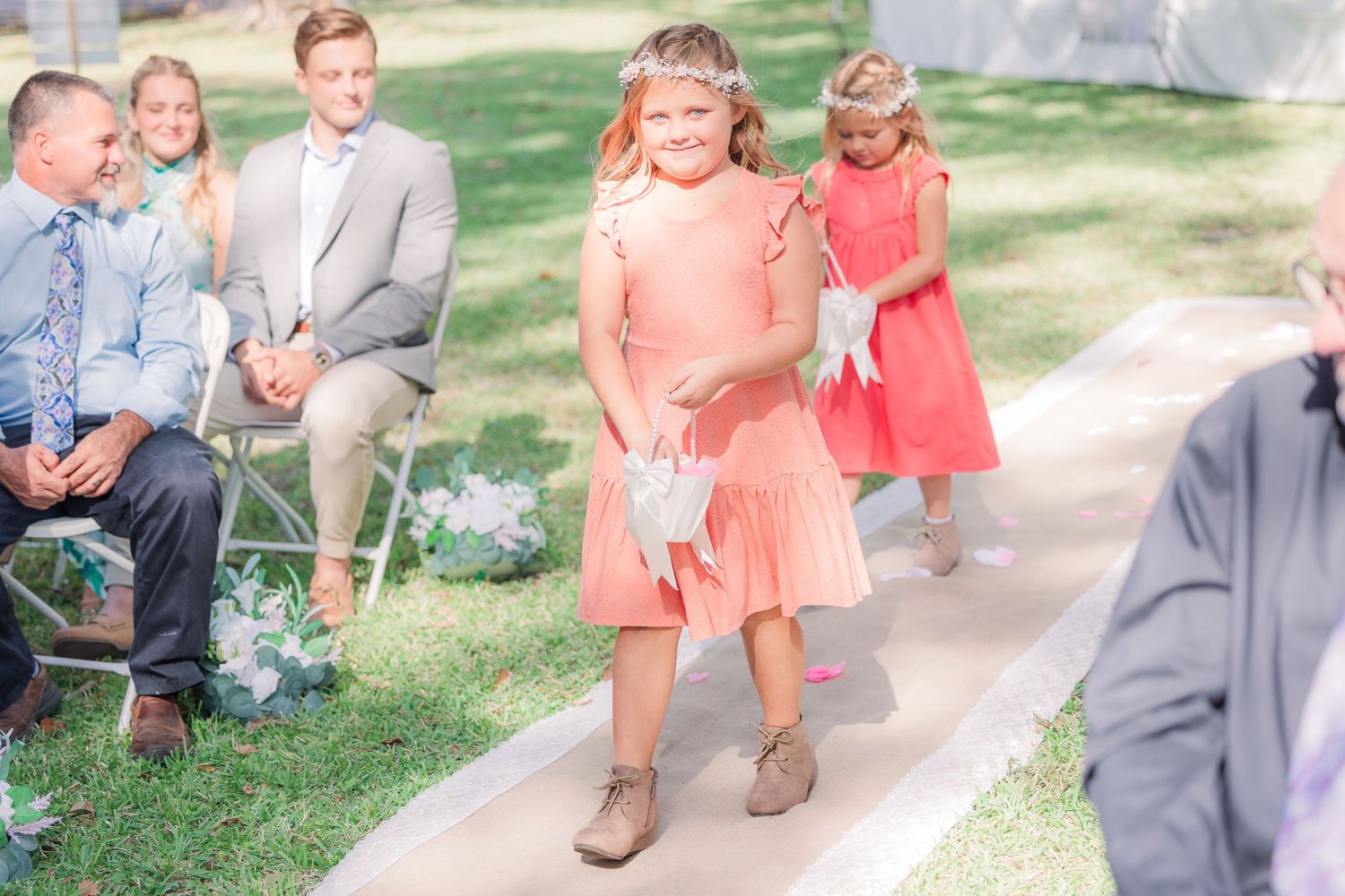 Wedding guests in casual attire gather on outdoor wedding groom bride wilmington photographer light and airy classic Wrightsville Beach