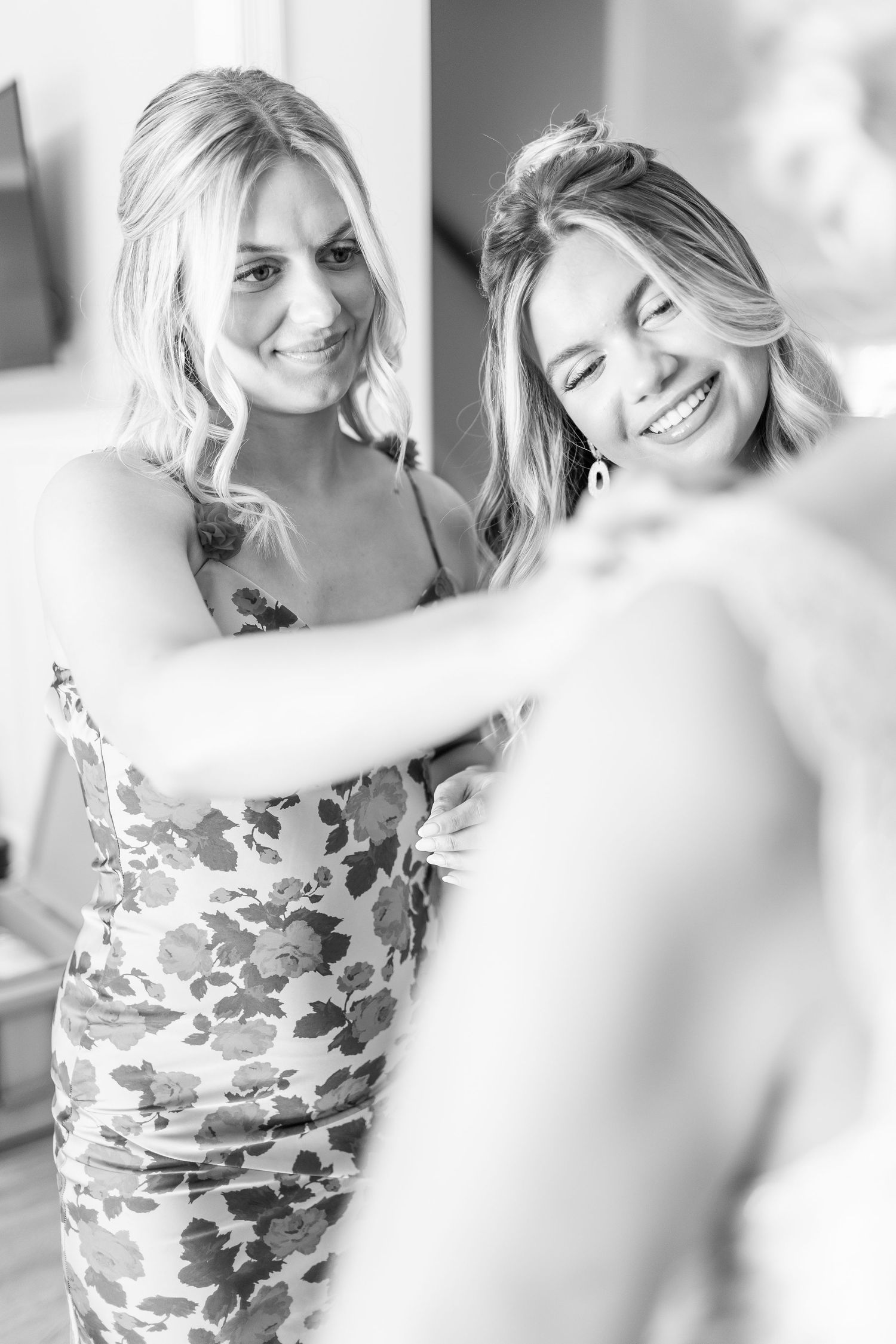 Candid black and white moments during wedding preparation.