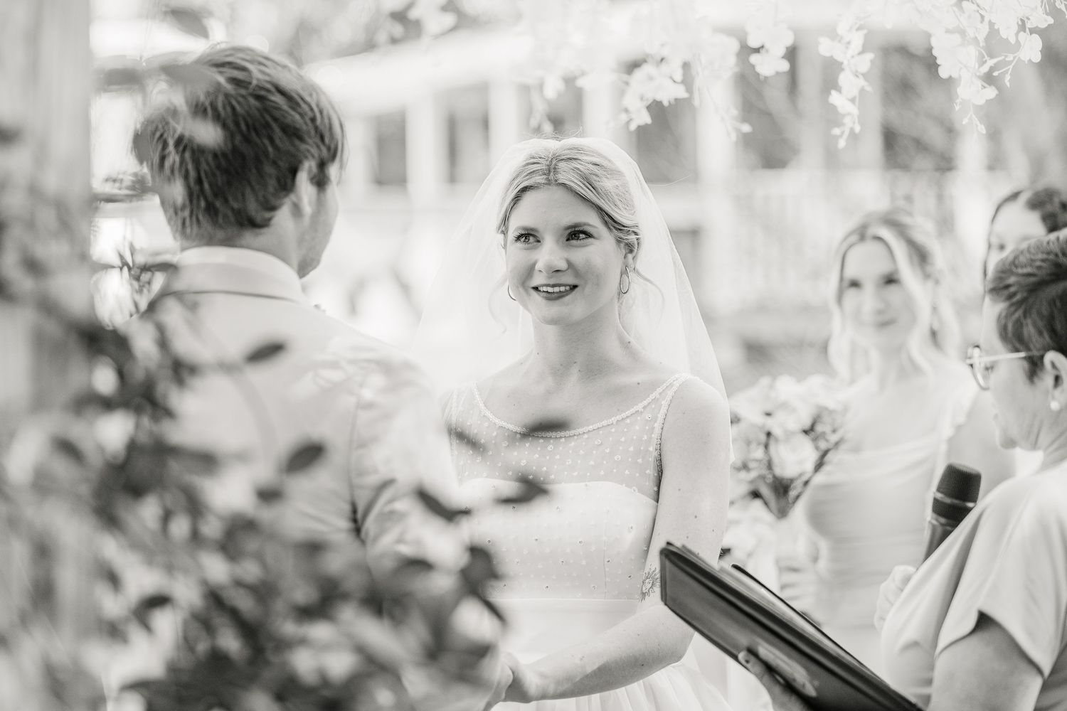 Black and white photo of wedding ceremony moments in garden wedding groom bride wilmington photographer light and airy classic Wrightsville