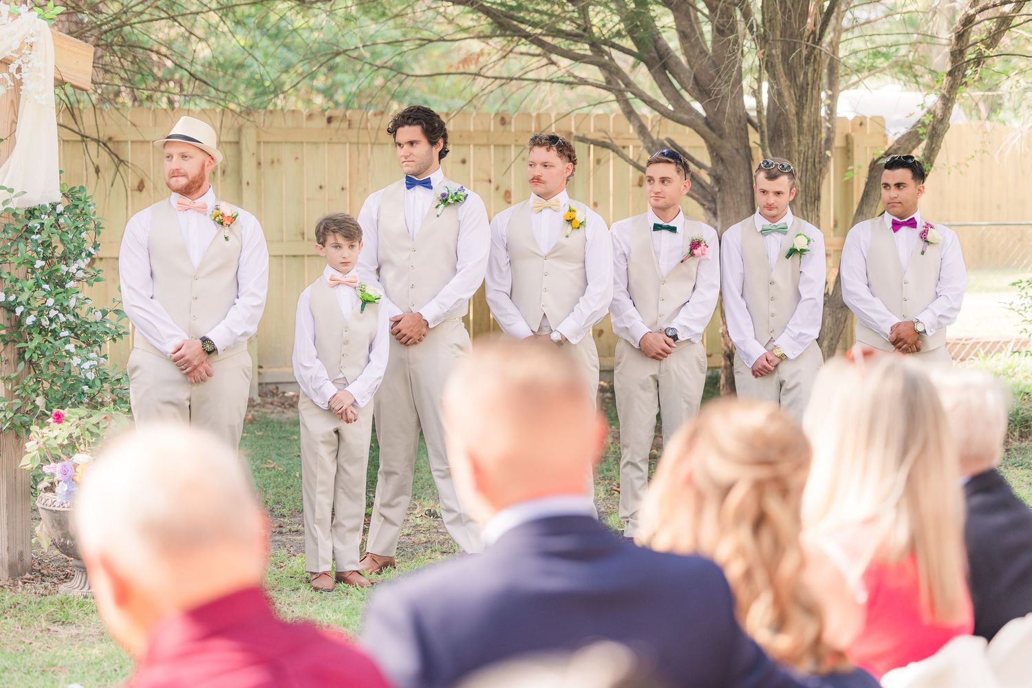 Wedding ceremony guests seated outdoors wedding groom bride wilmington photographer light and airy classic Wrightsville Beach