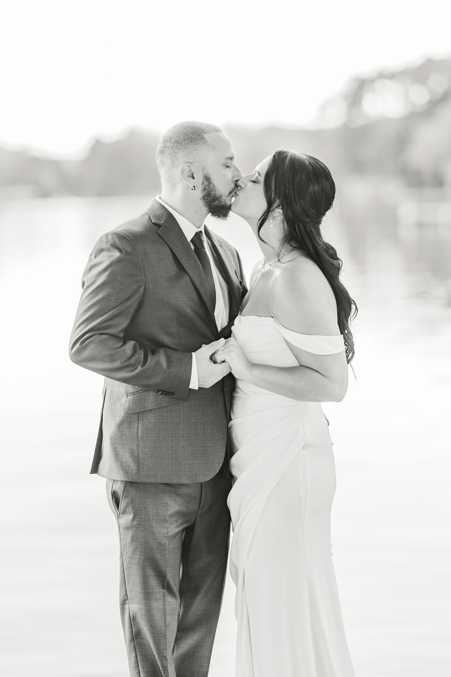Black and white wedding portraits showing intimate moments between newlyweds wedding groom bride lake Gaston photographer light airy