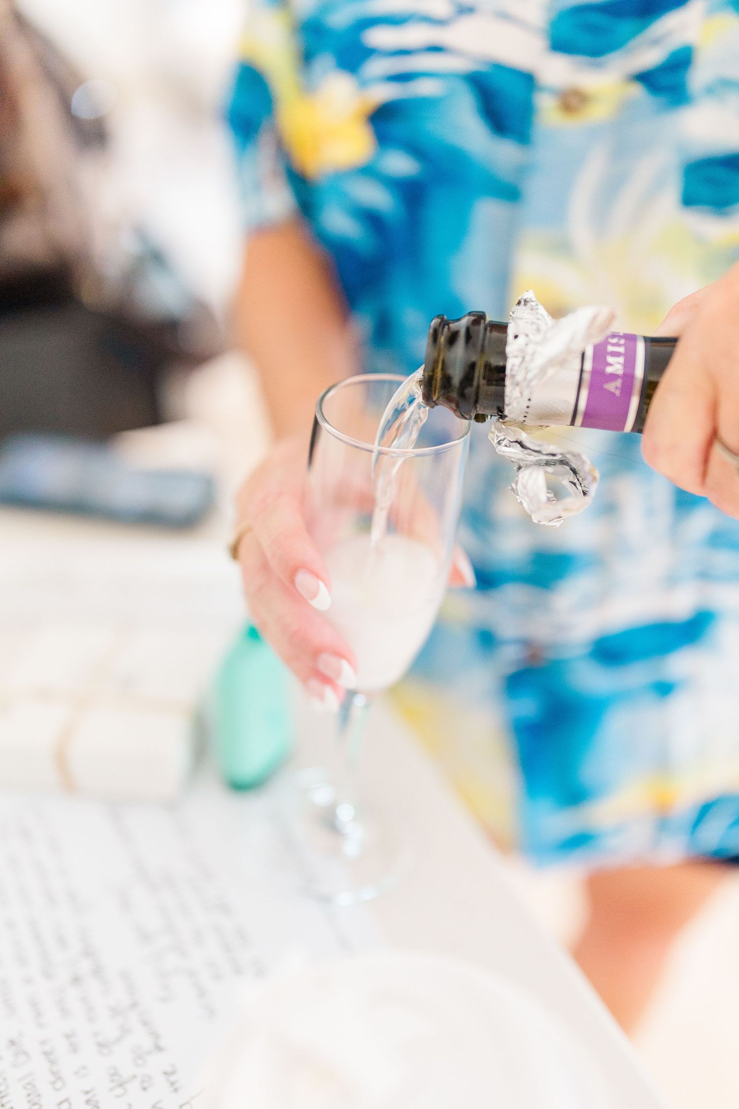Close-up details of champagne glasses and tropical attire during wedding preparations southport elopement wedding bride groom light and airy