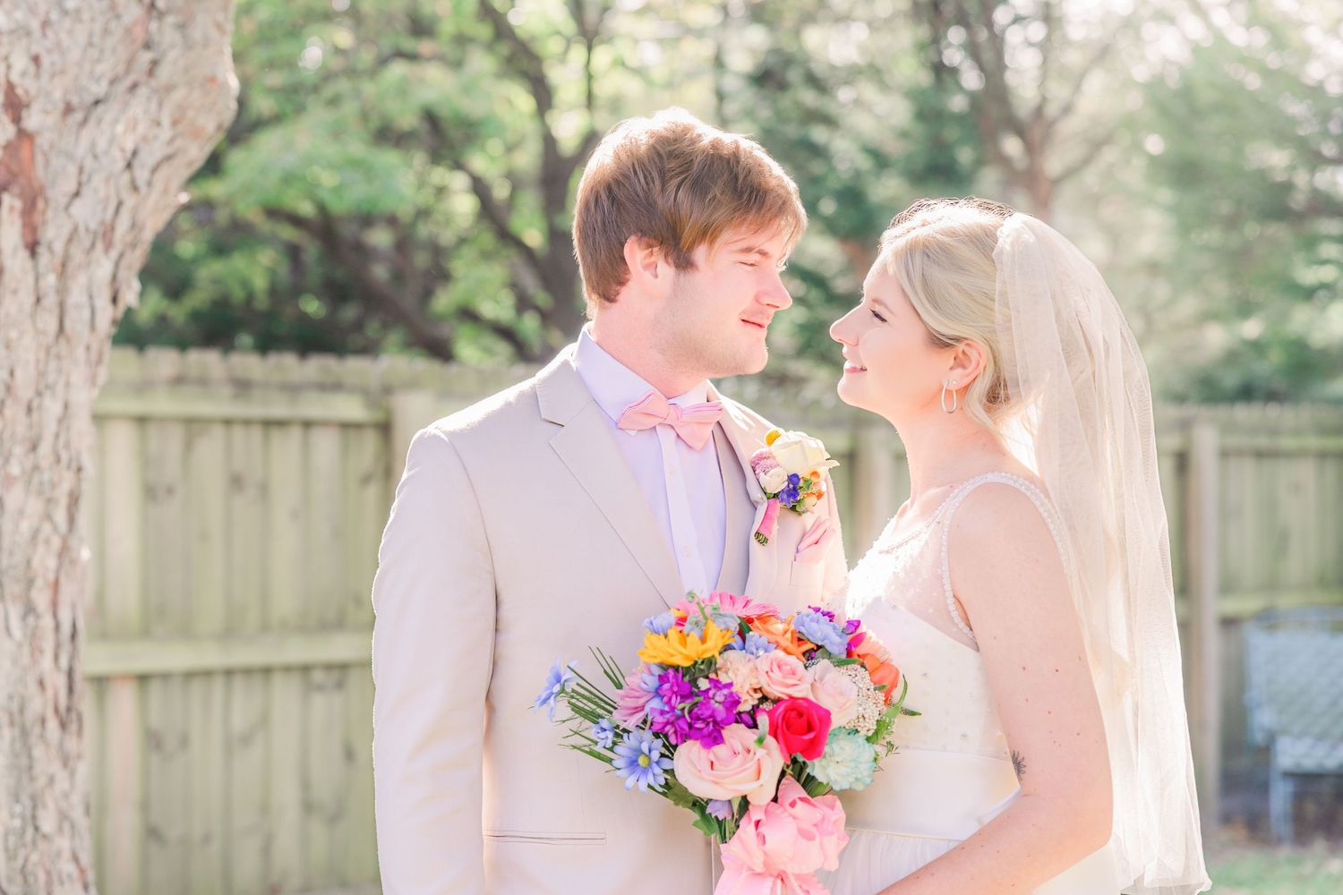 wedding couple portraits vibrant floral bouquets wedding groom bride wilmington photographer light and airy classic Wrightsville Beach