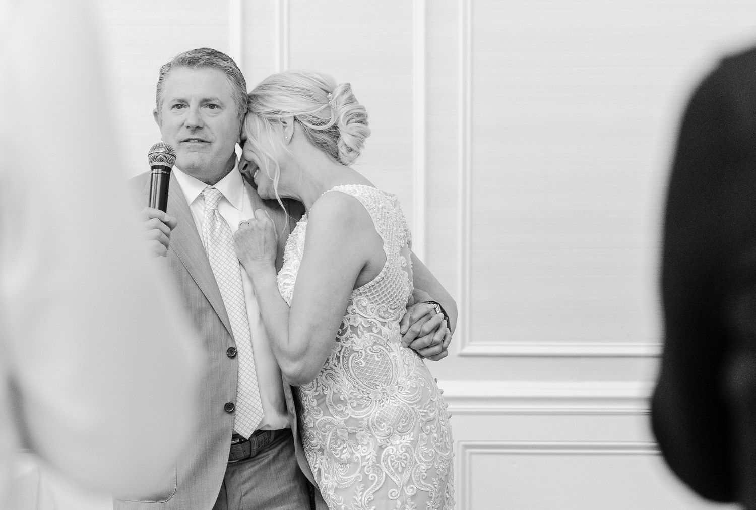 Black and white photos capturing intimate moments during a wedding reception.