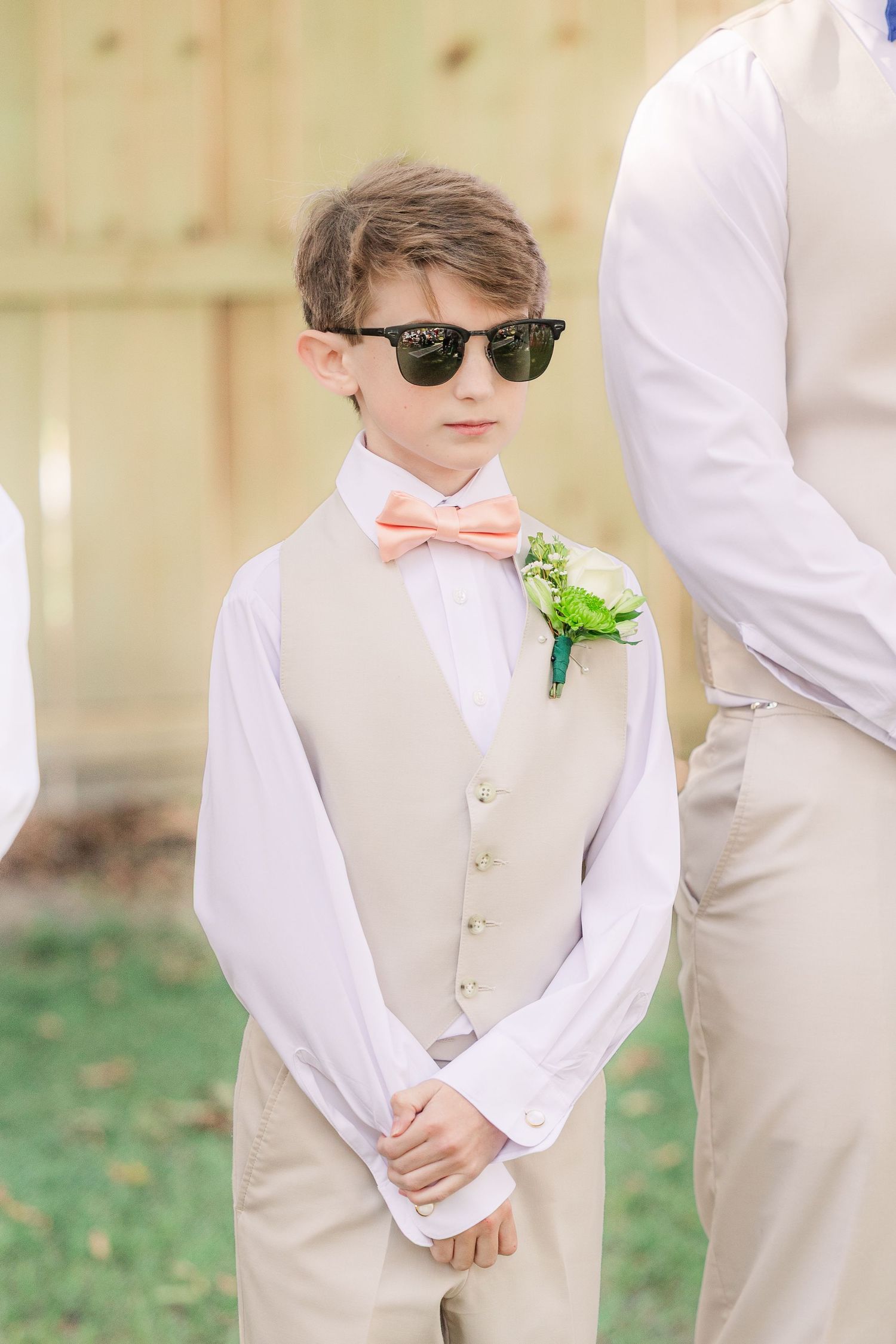 Young groomsmen in beige vests and white shirts wedding groom bride wilmington photographer light and airy classic Wrightsville Beach