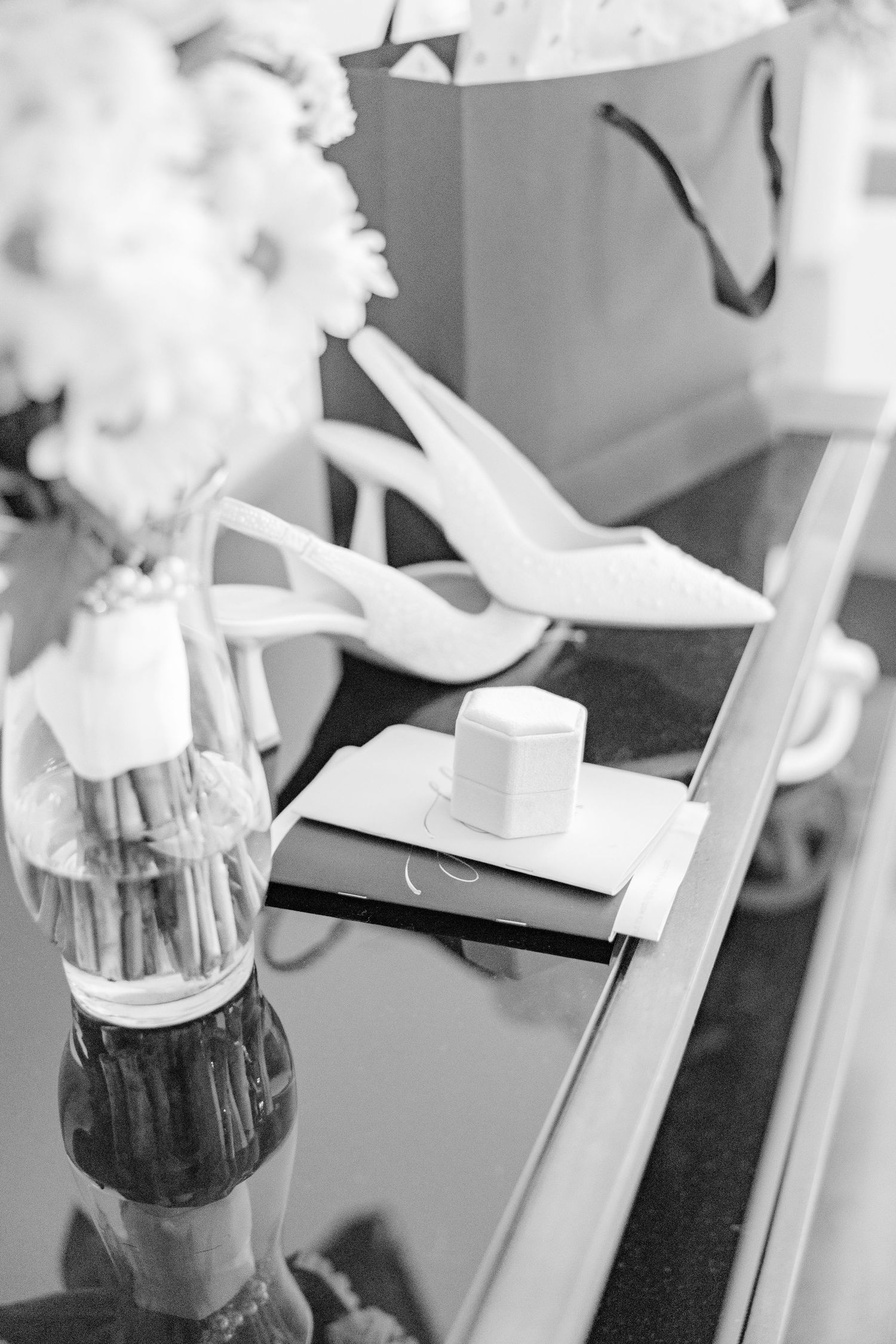 Black and white table settings with white floral centerpieces at an elegant event wedding groom bride lake Gaston photographer light airy