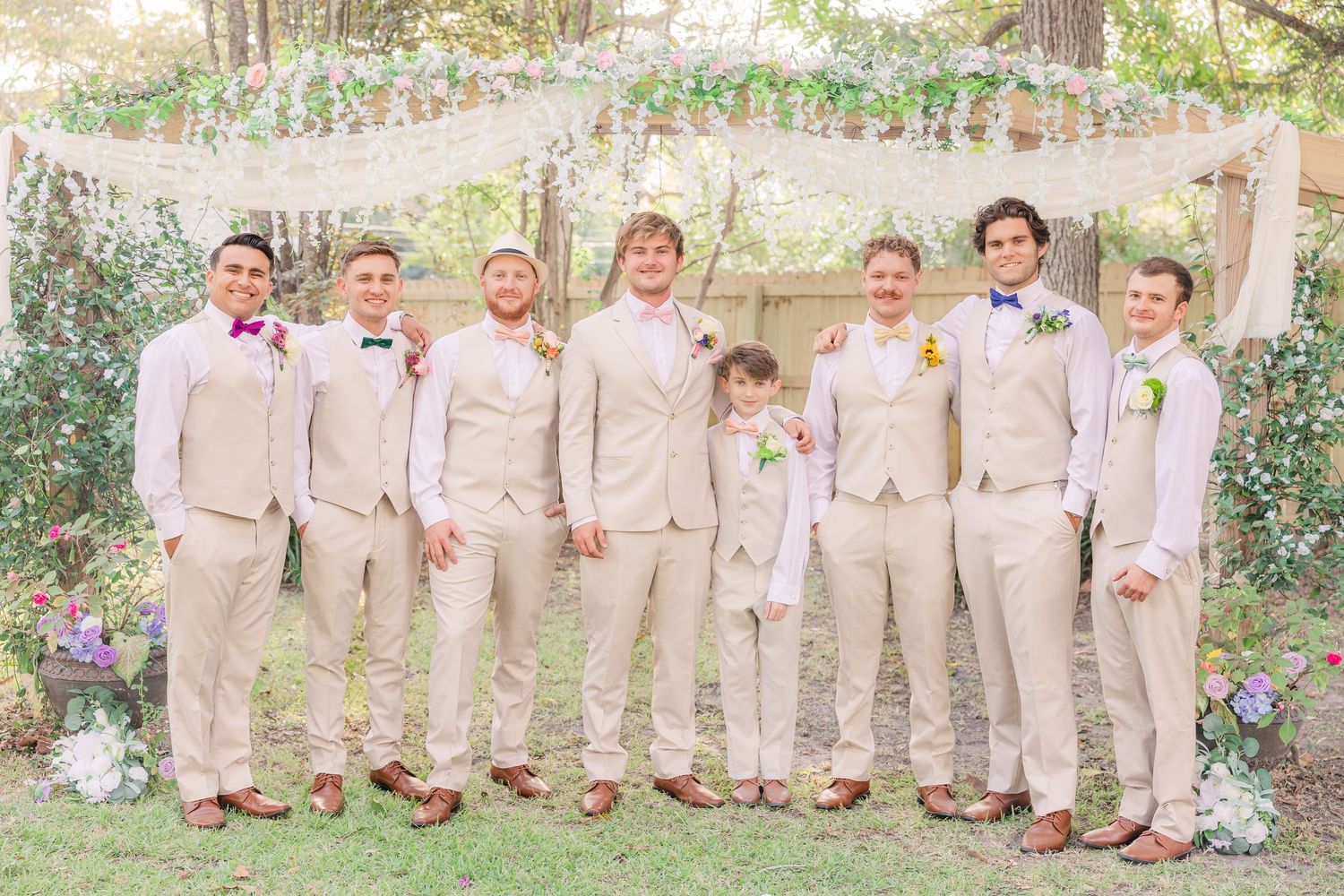 Wedding party members line up wedding groom bride wilmington photographer light and airy classic Wrightsville Beach