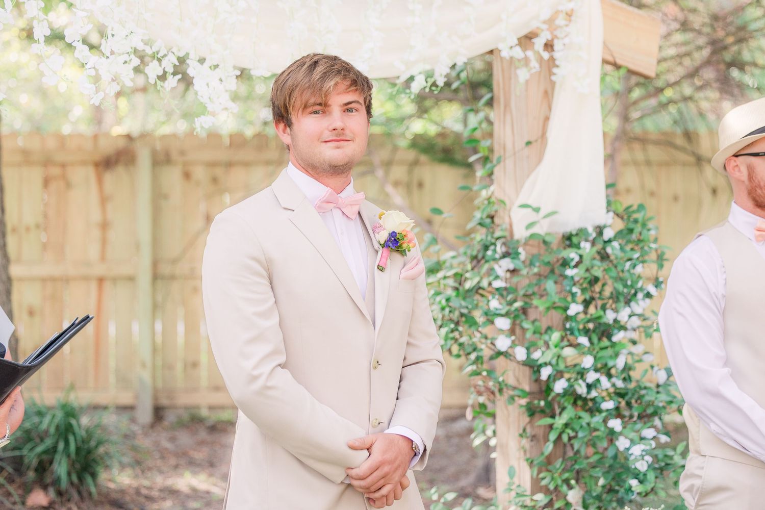 Wedding party members in light colored suits wedding groom bride wilmington photographer light and airy classic Wrightsville Beach