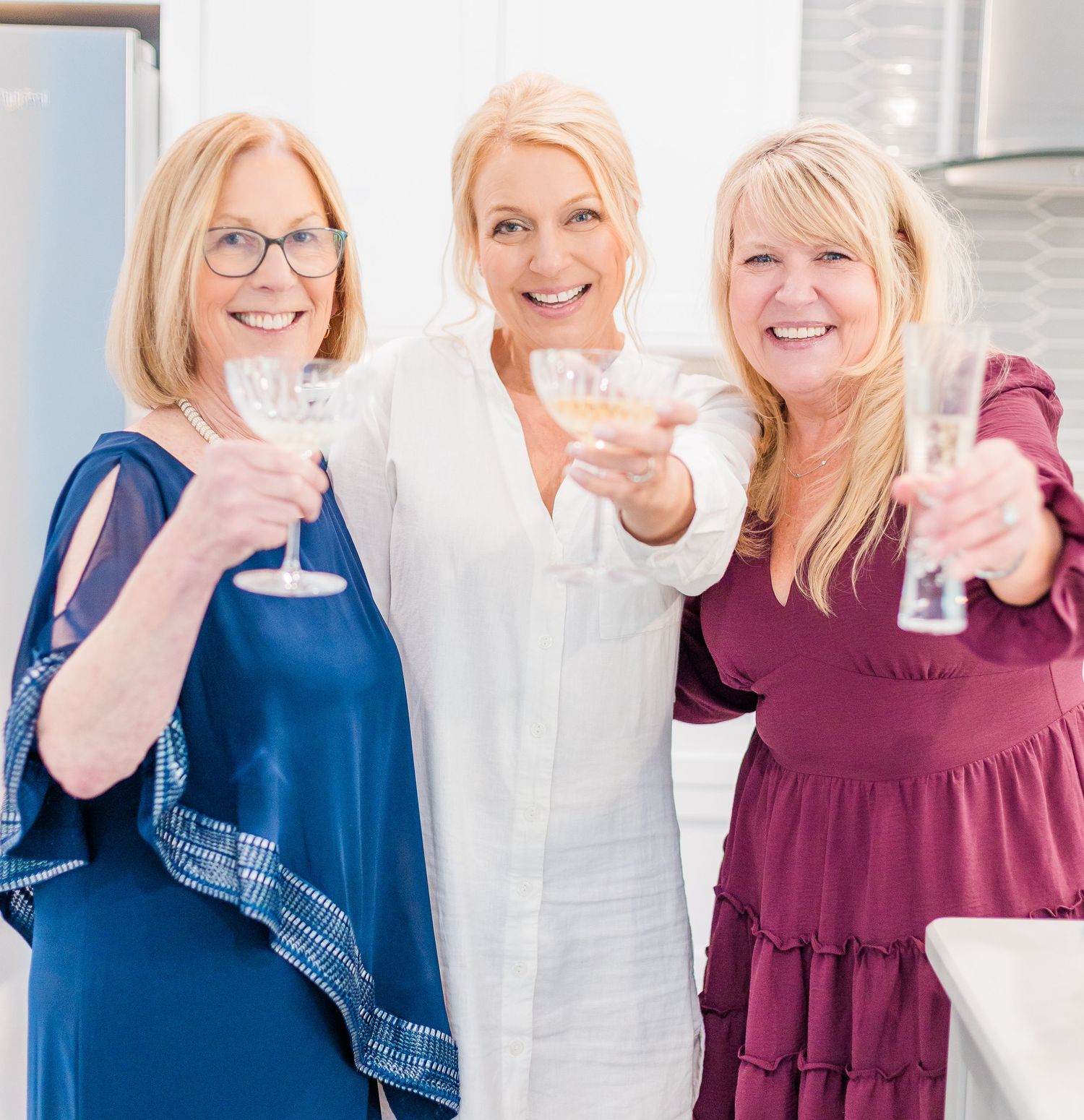 Group of friends toasting with drinks  landfall wedding bride groom light and airy classic wilmington Wrightsville Beach