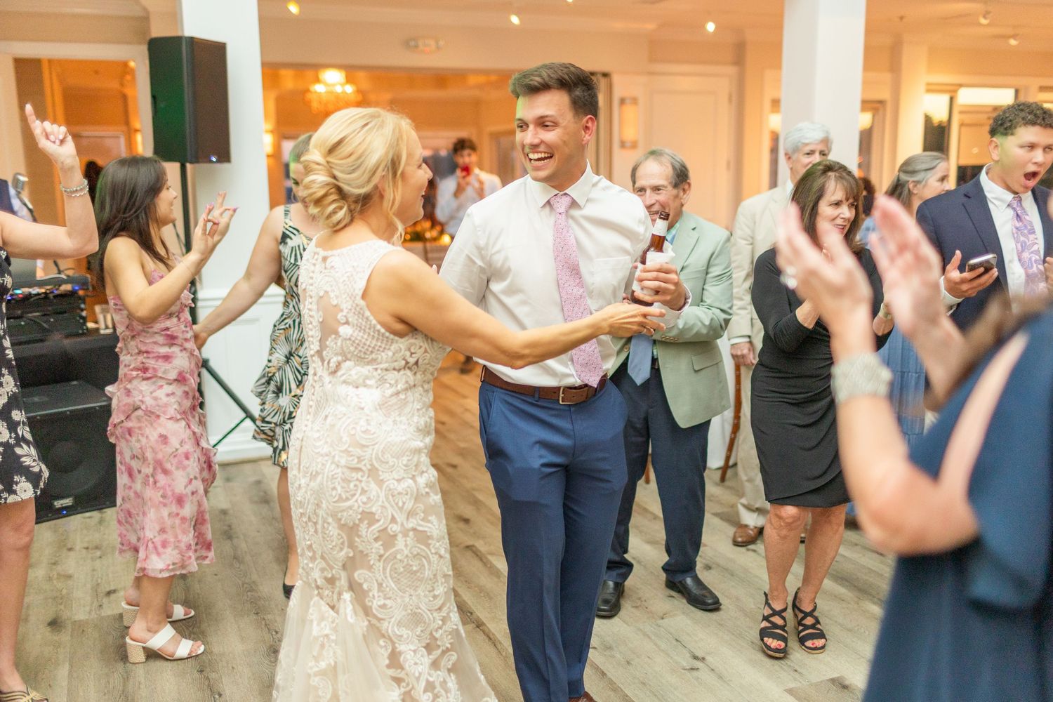 Wedding reception guests dancing and enjoying themselves  landfall wedding bride groom light and airy classic wilmington Wrightsville Beach