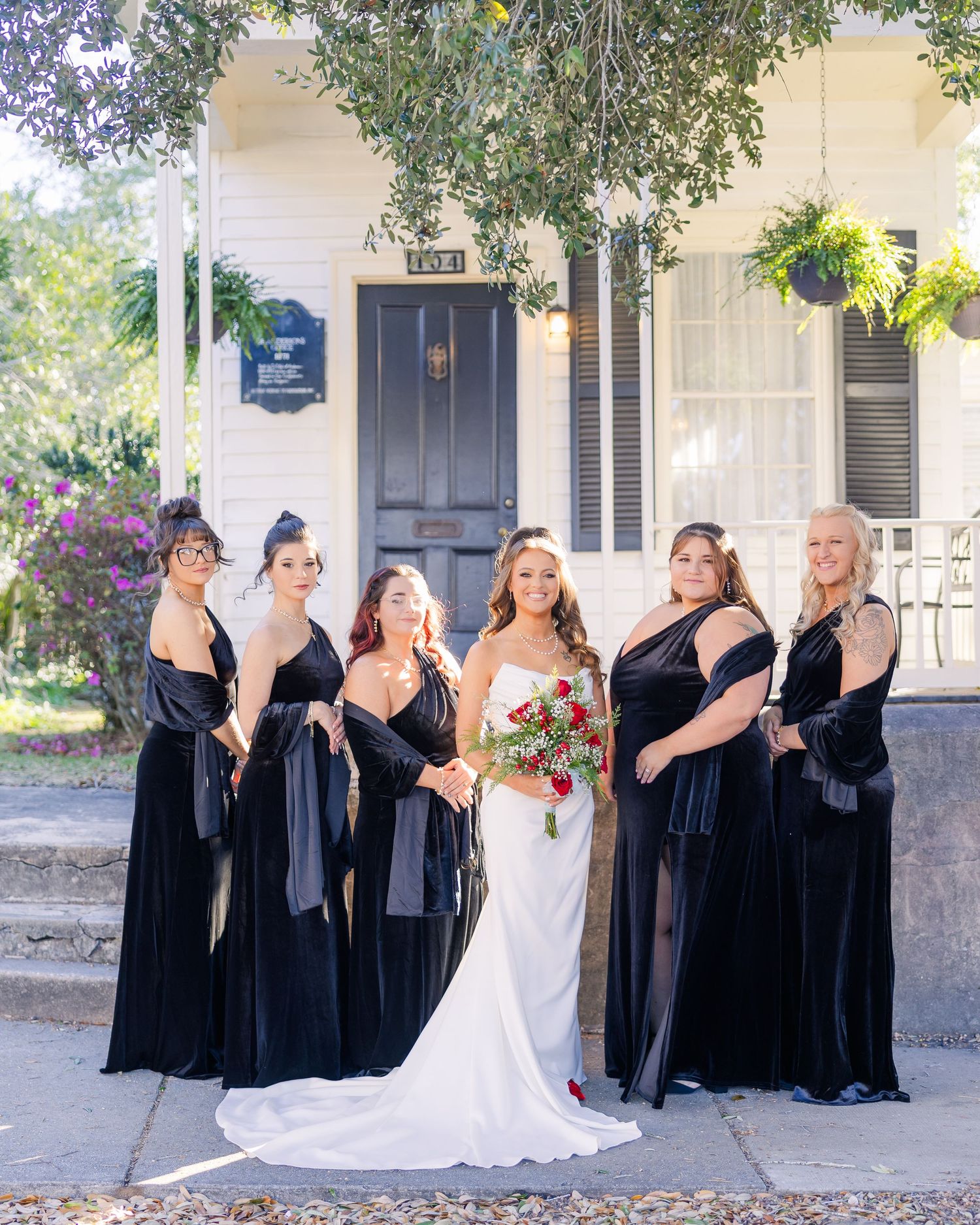 Fun group photo of wedding party with bridesmaids in black dresses making silly poses wedding groom bride wilmington North Carolina photogra