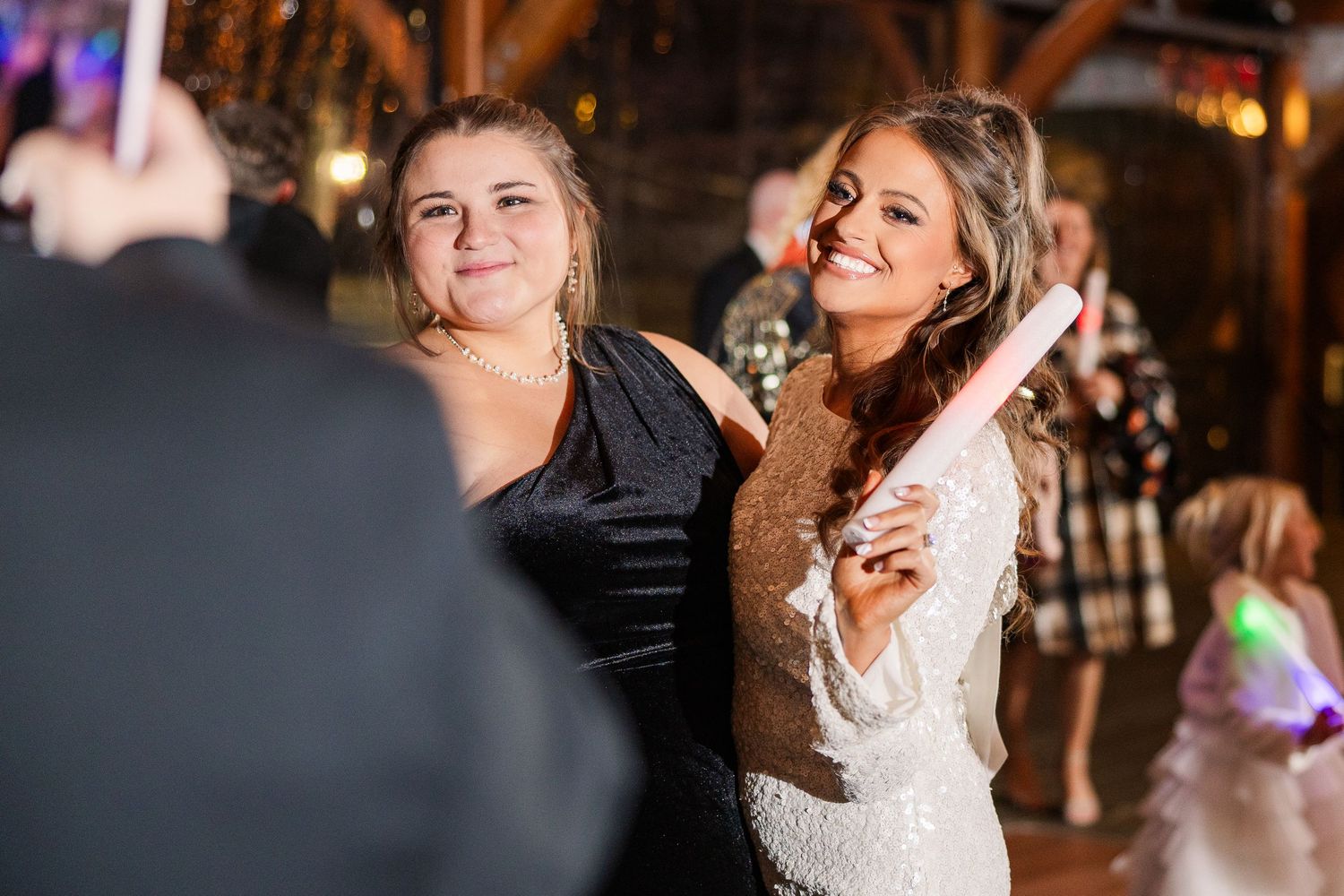 Wedding reception guests dancing and celebrating on the dance floor wedding groom bride wilmington North Carolina photographer light airy