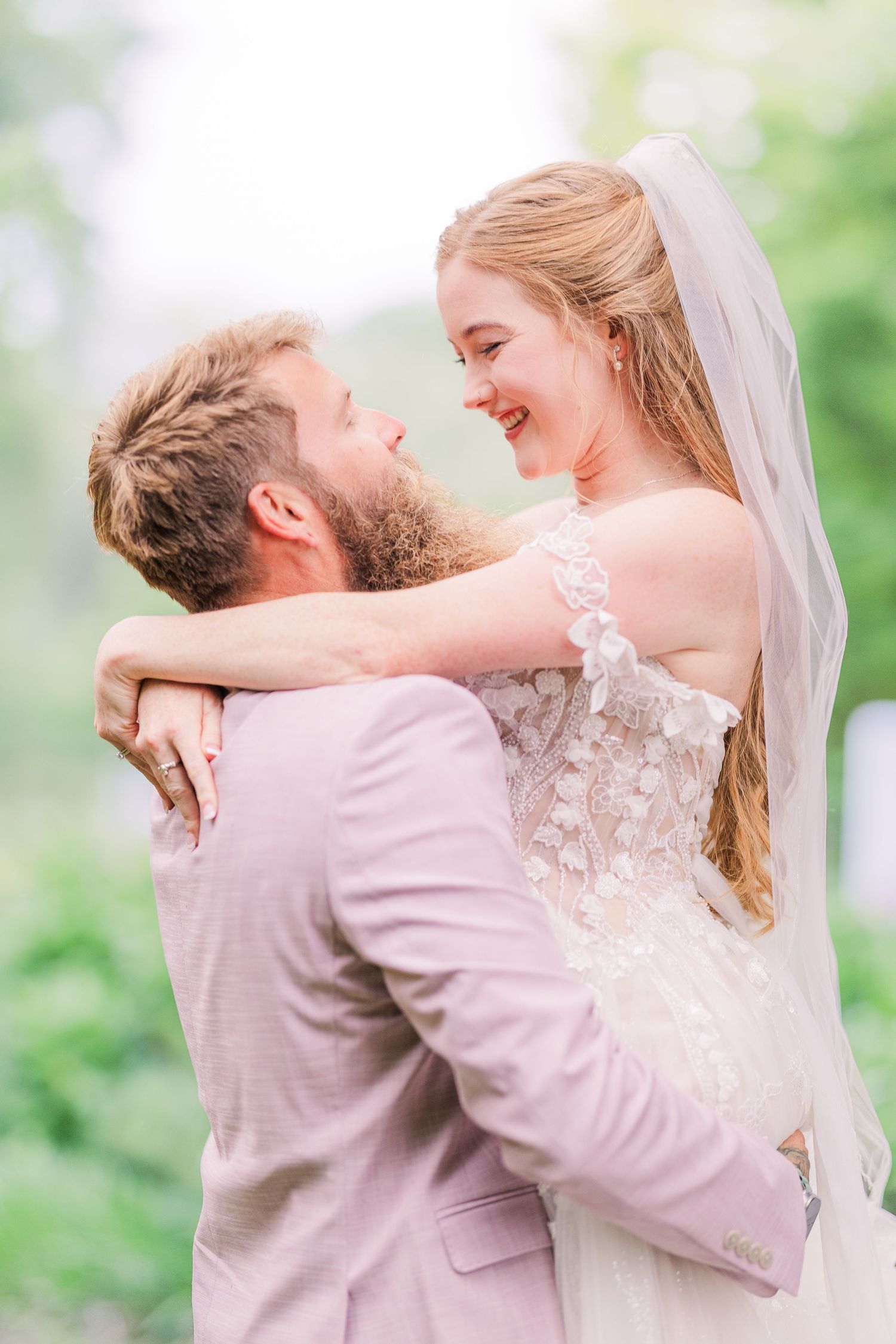 Intimate wedding portraits showing tender moments between couple in soft pastel tones in harborway gardens in Wrightsville Beach, nc
