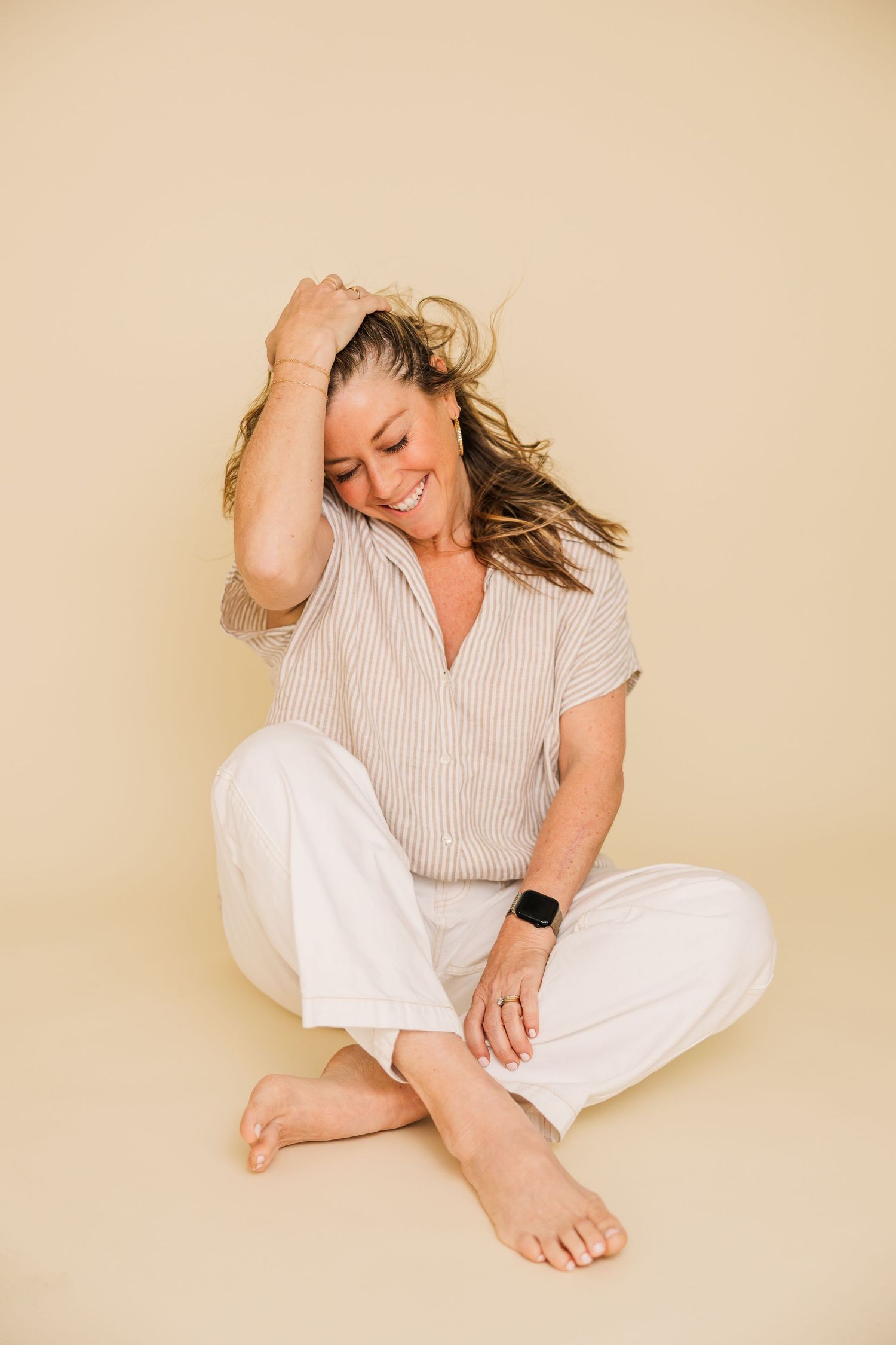 Artistic portrait series showing relaxed poses on neutral studio background.