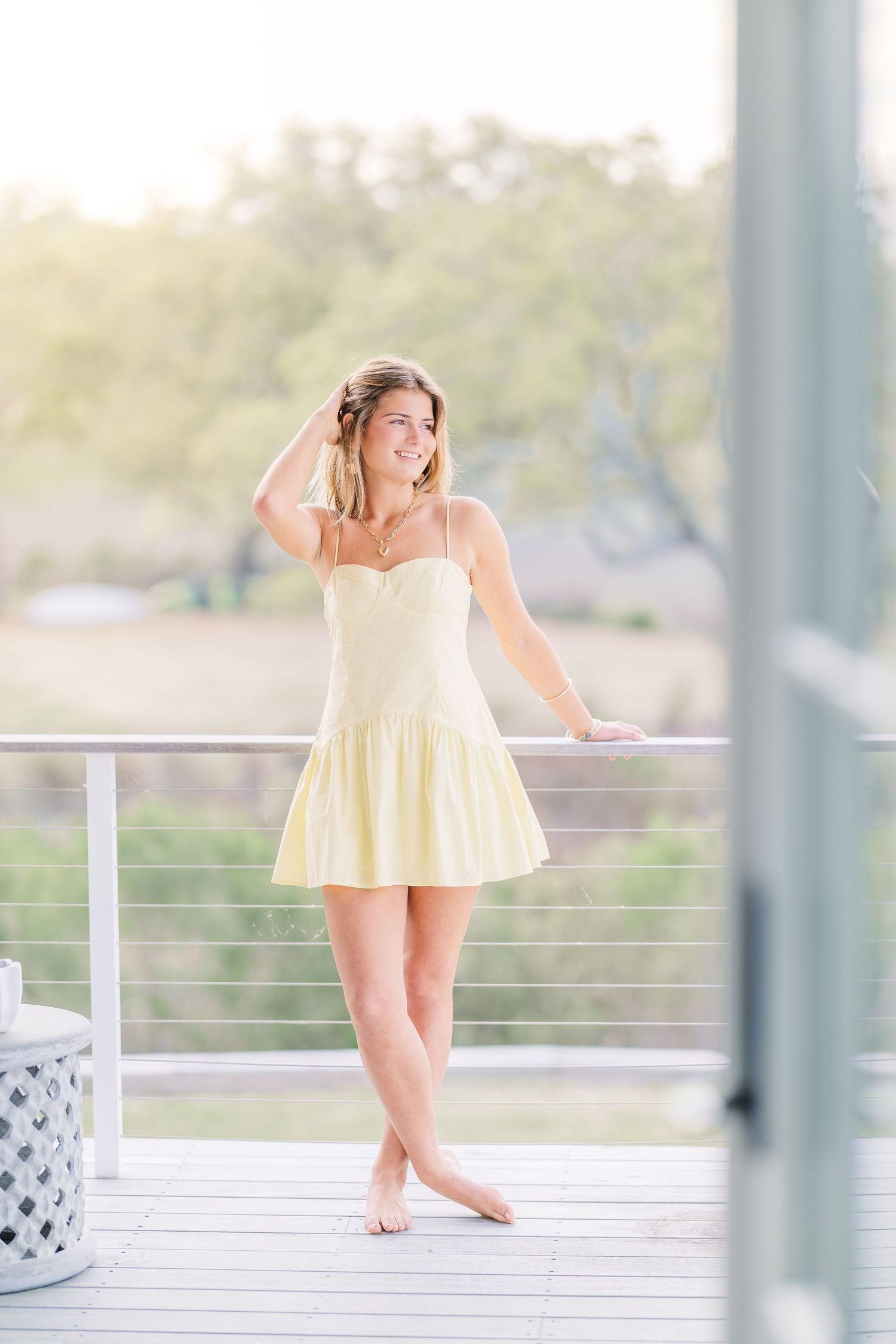 A breezy summer scene on a deck with white railings and soft natural lighting.