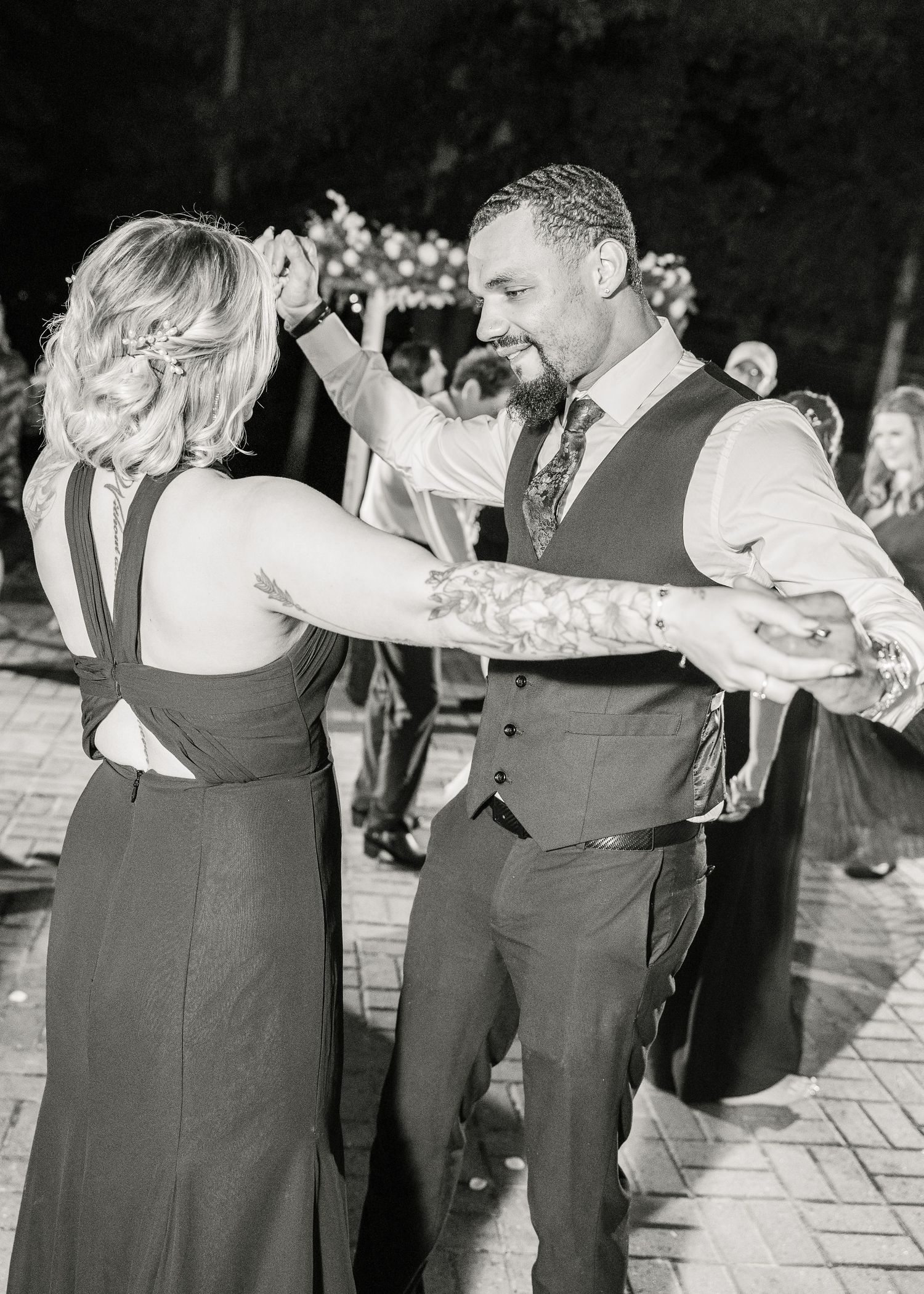 Couples dancing in formal attire at evening outdoor wedding reception wedding groom bride lake Gaston photographer light airy