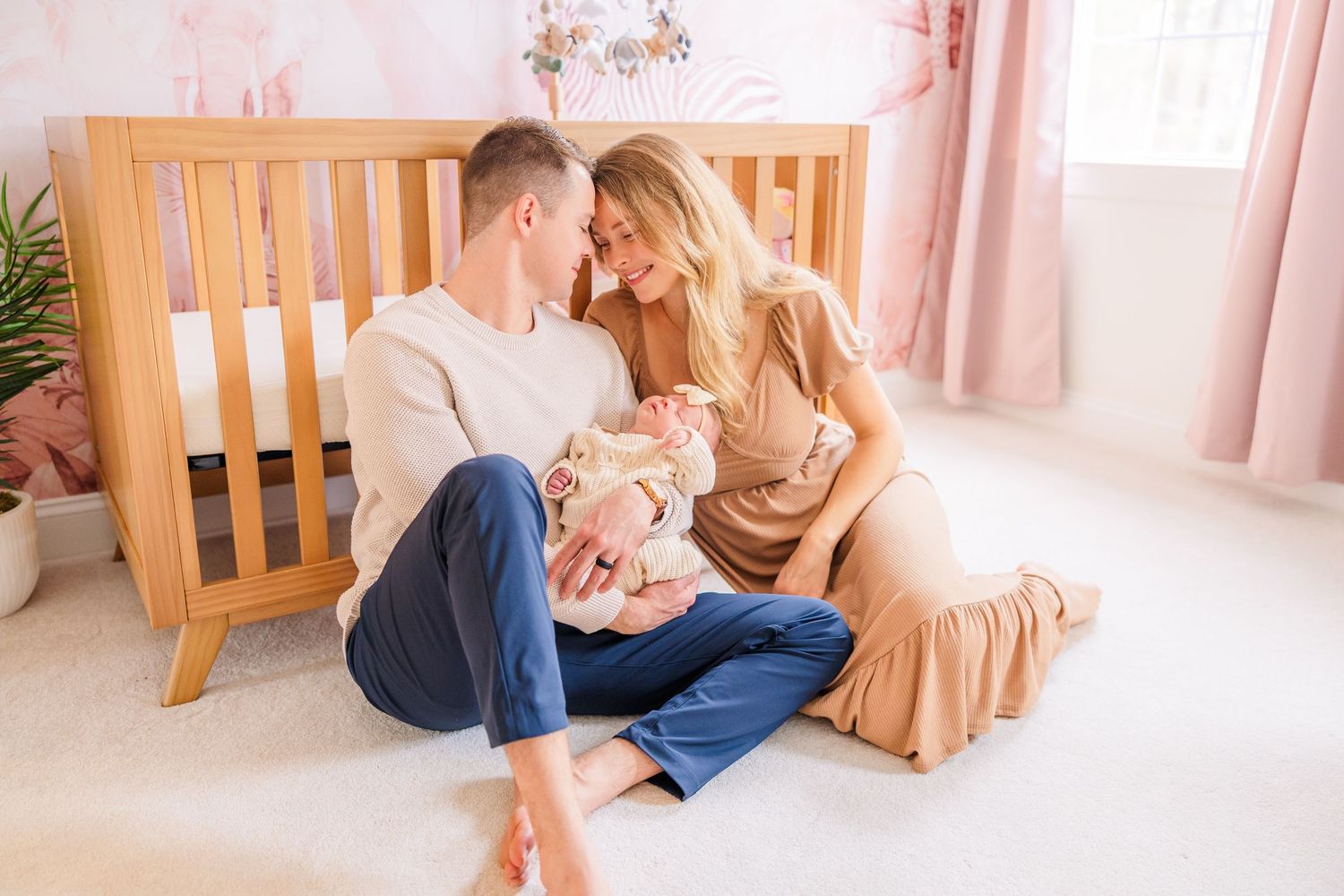 Candid family moments photographed in a cozy home setting with wooden furniture.