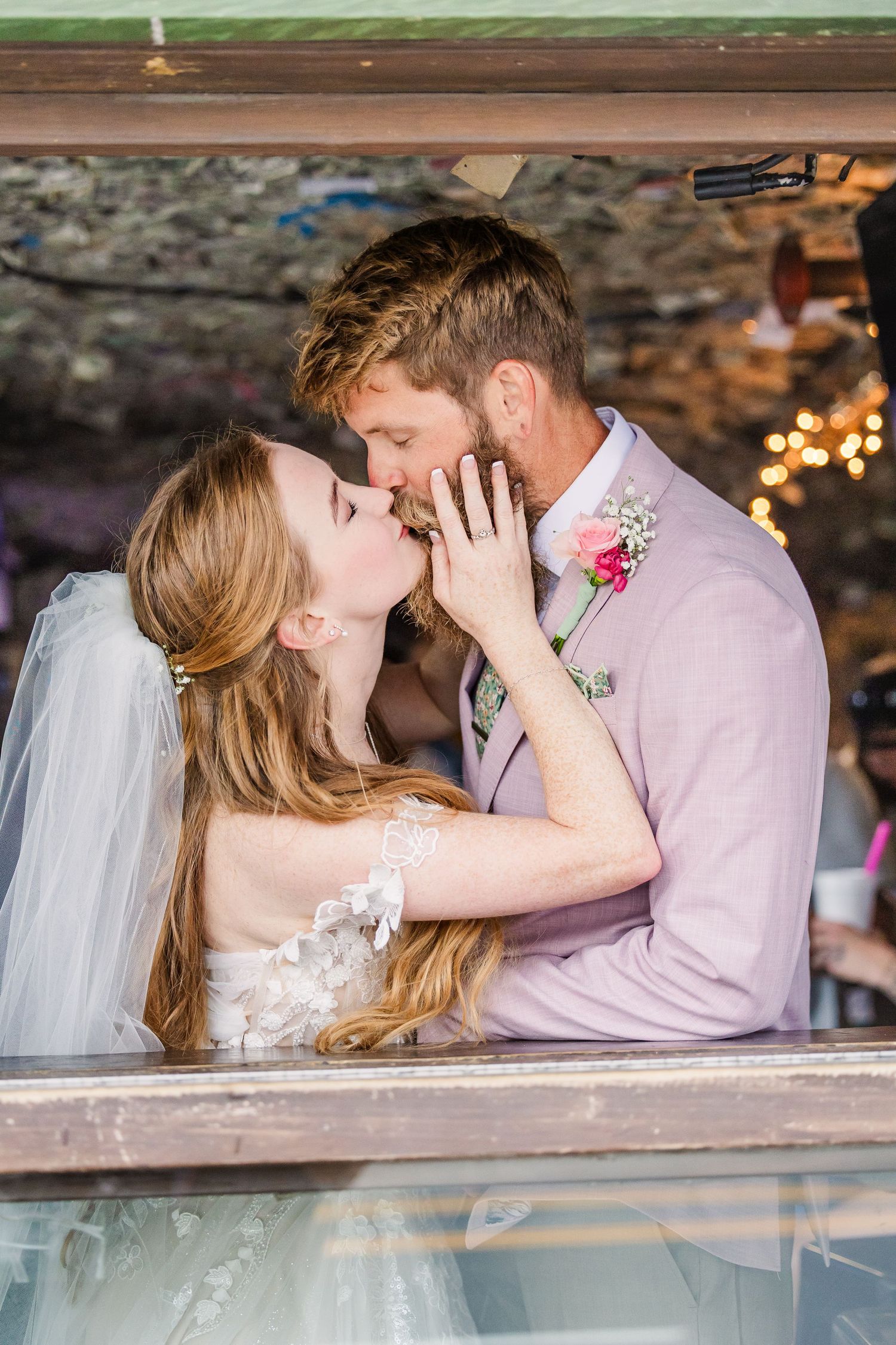 Wrightsville Beach bride and groom in jimmys dive bar embracing in a sweet moment