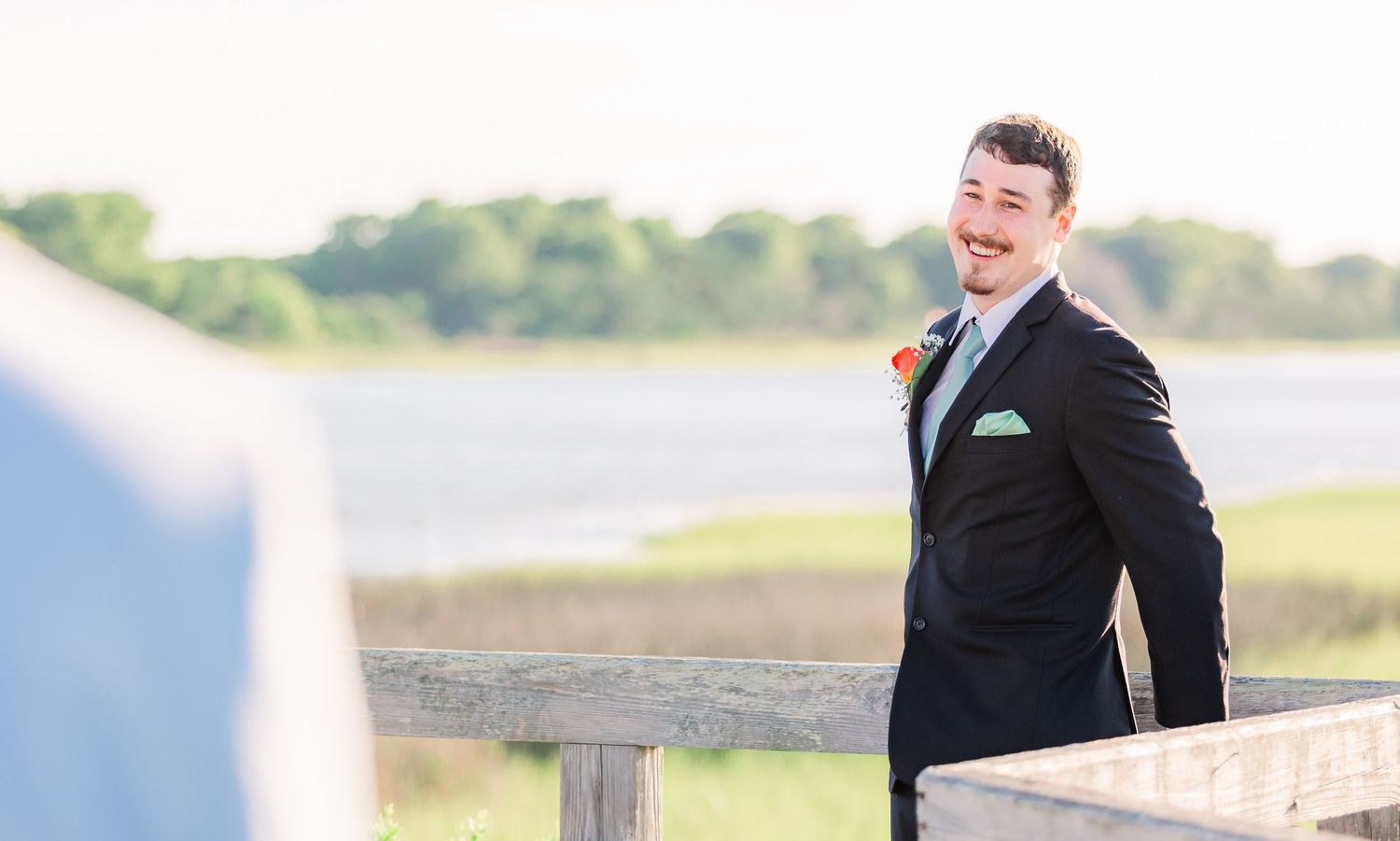 Groom portraits in formal attire against outdoor scenery southport elopement wedding bride groom light and airy classic