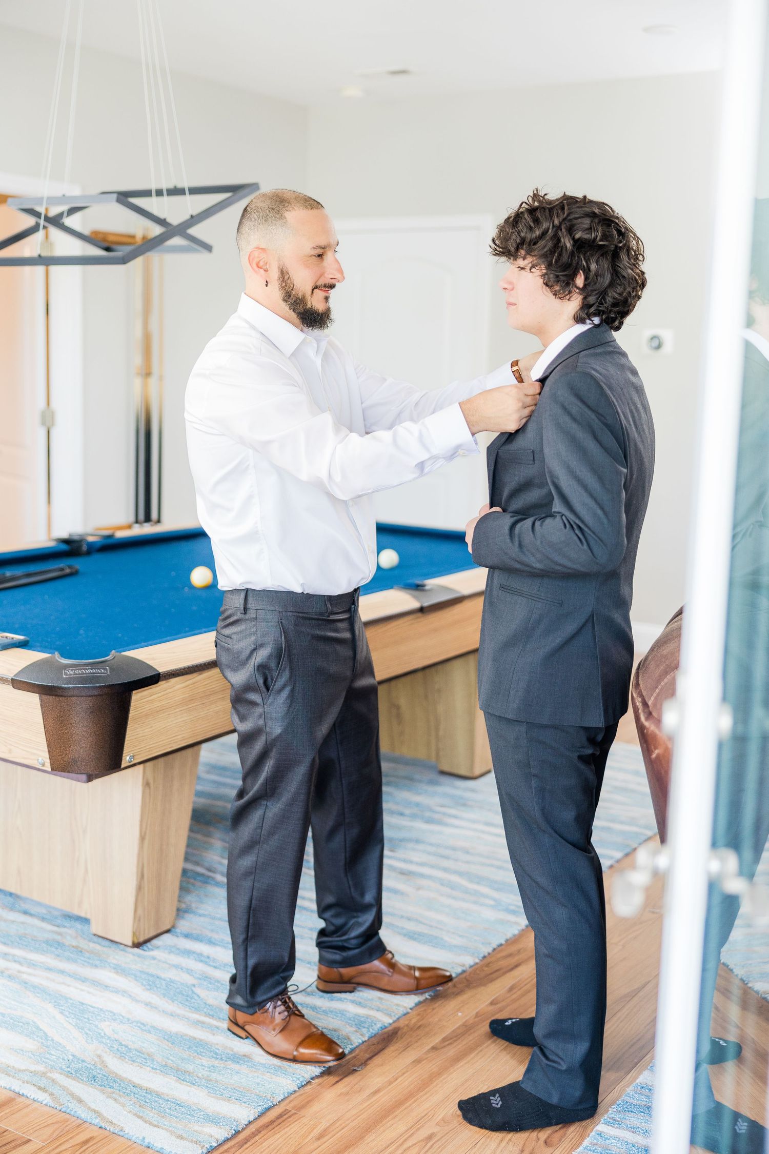 Men in formal attire adjusting clothing before an event wedding groom bride lake Gaston photographer light airy