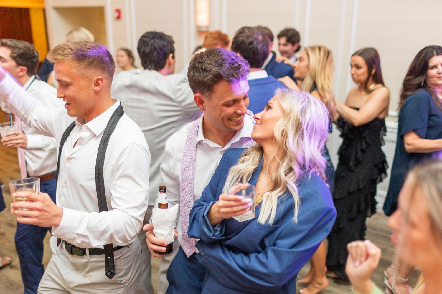 Wedding guests enjoying themselves on the dance floor  landfall wedding bride groom light and airy classic wilmington Wrightsville Beach