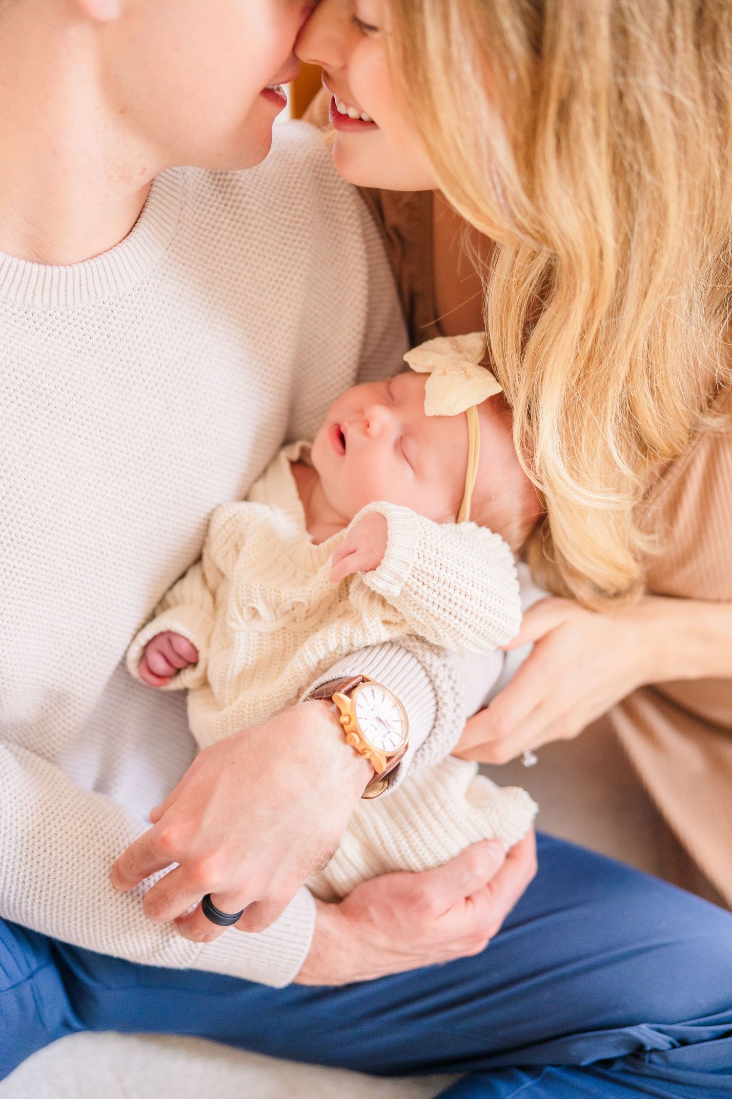 Close-up shots of tender family moments in soft natural lighting.