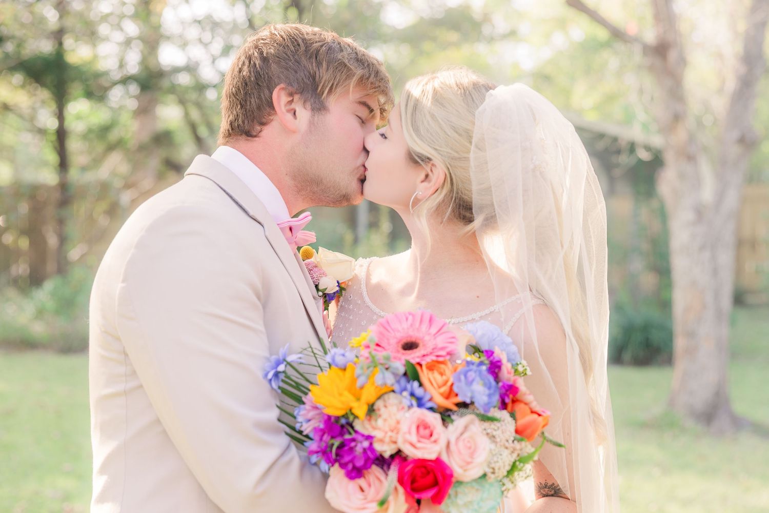 Couple shares romantic kisses wedding groom bride wilmington photographer light and airy classic Wrightsville Beach