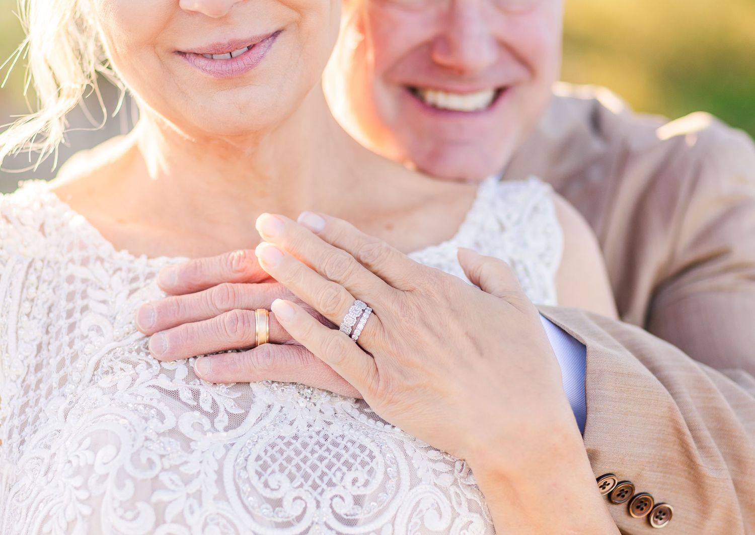 Close up of engagement ring and lace details from wedding day.