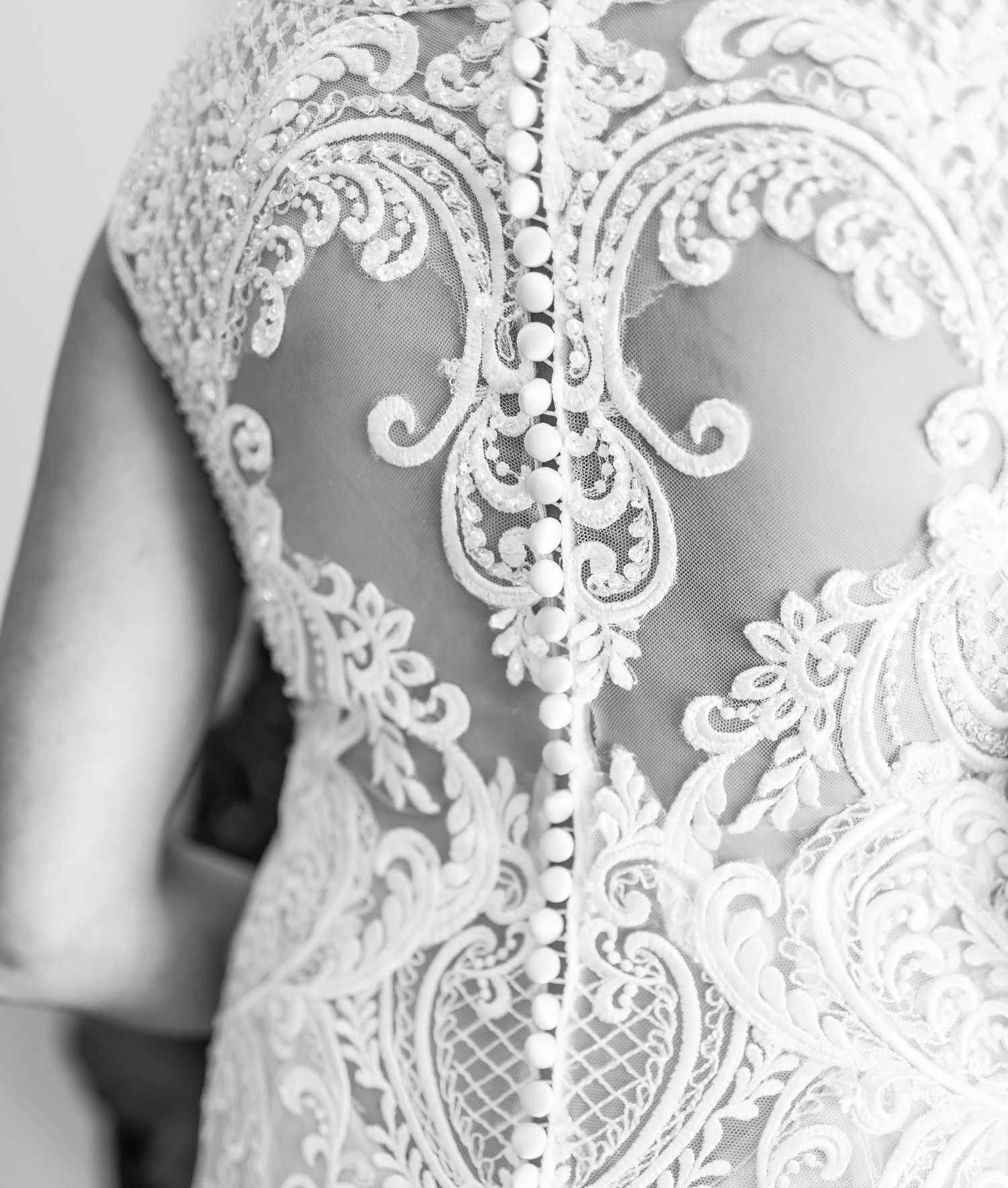 Detailed macro shots of intricate white lace wedding dress patterns.