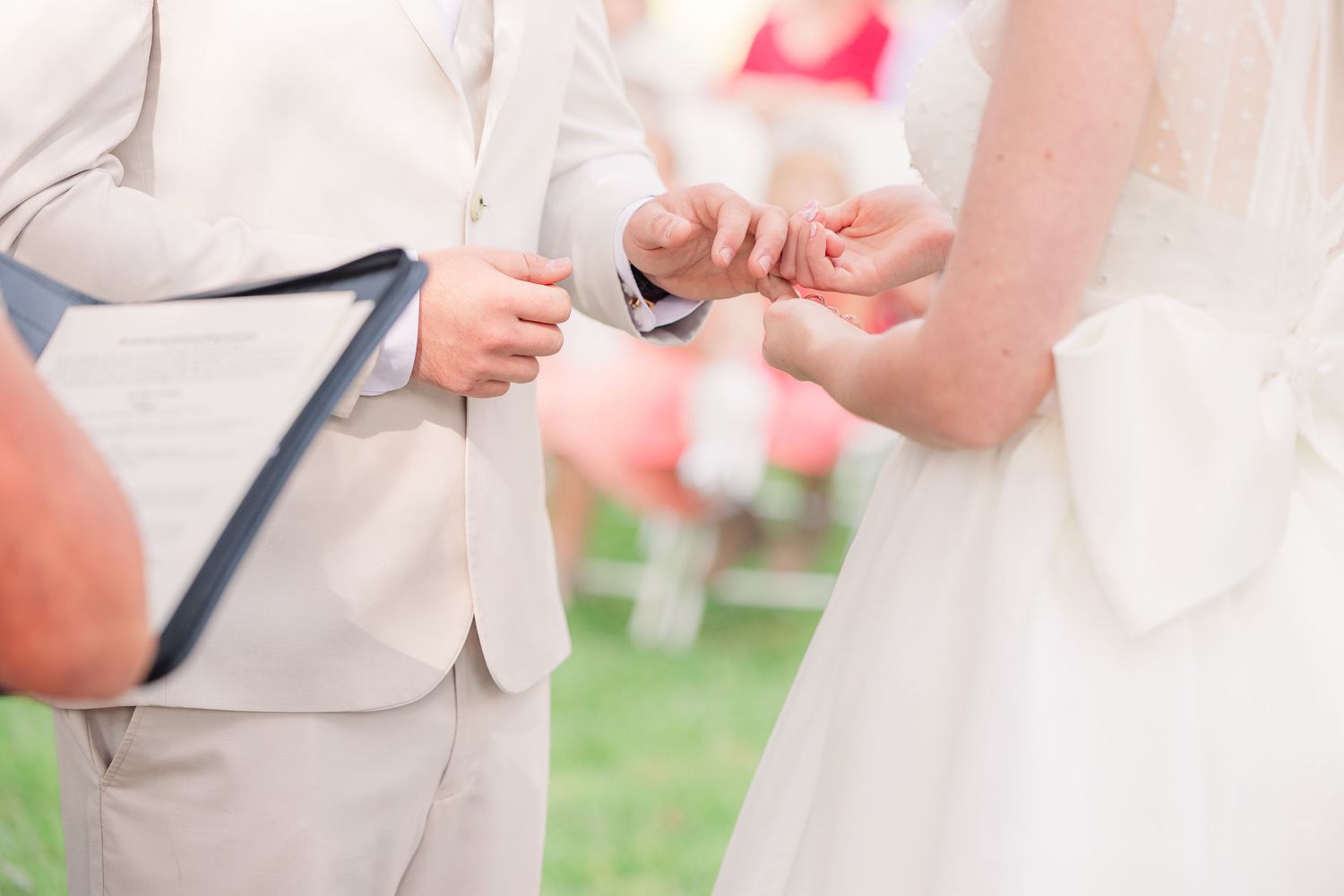 Close-up details of wedding ceremony moments with white dress and light-colored suit wedding groom bride wilmington photographer light airy