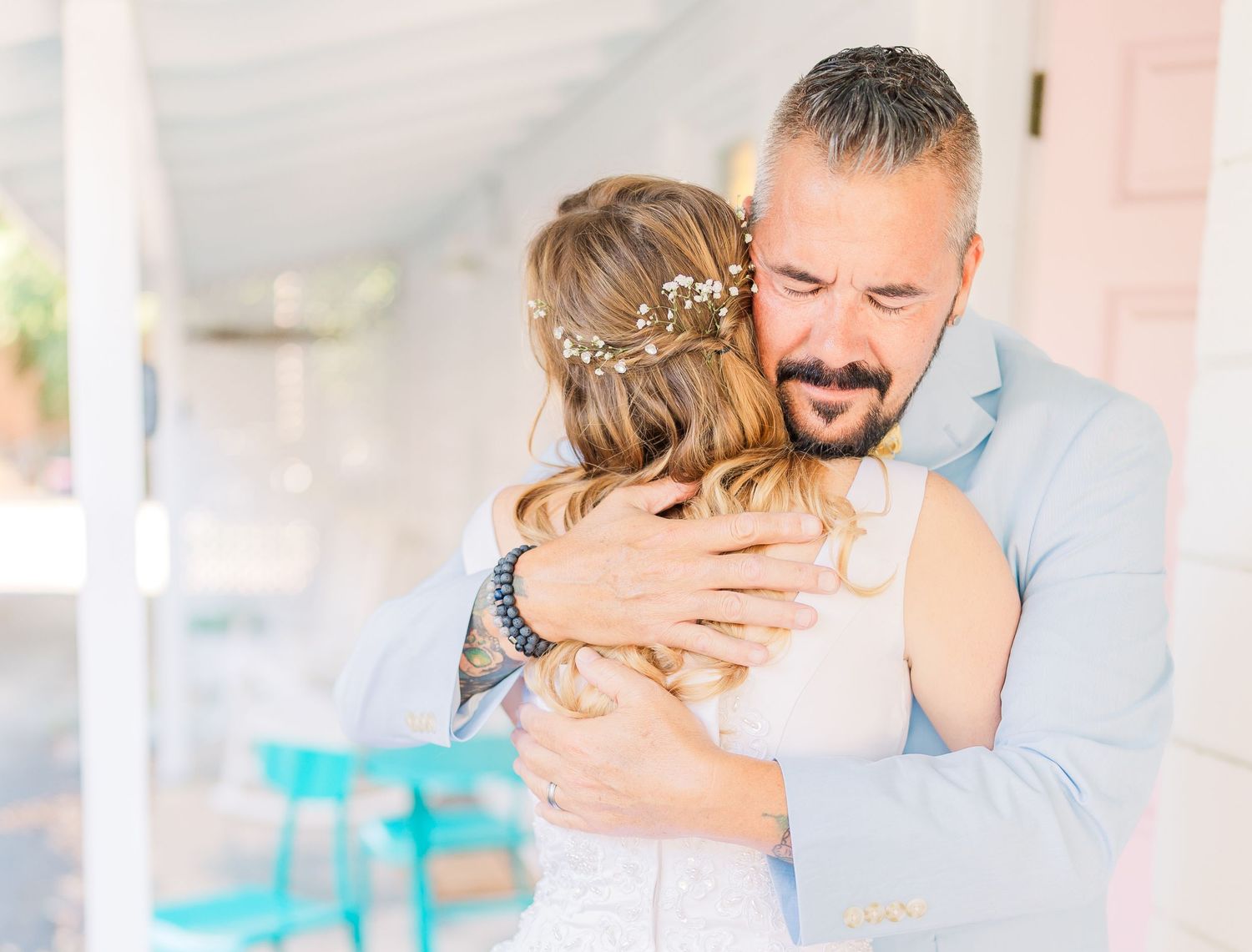 Tender embrace between newlyweds during first look moment southport elopement wedding bride groom light and airy classic