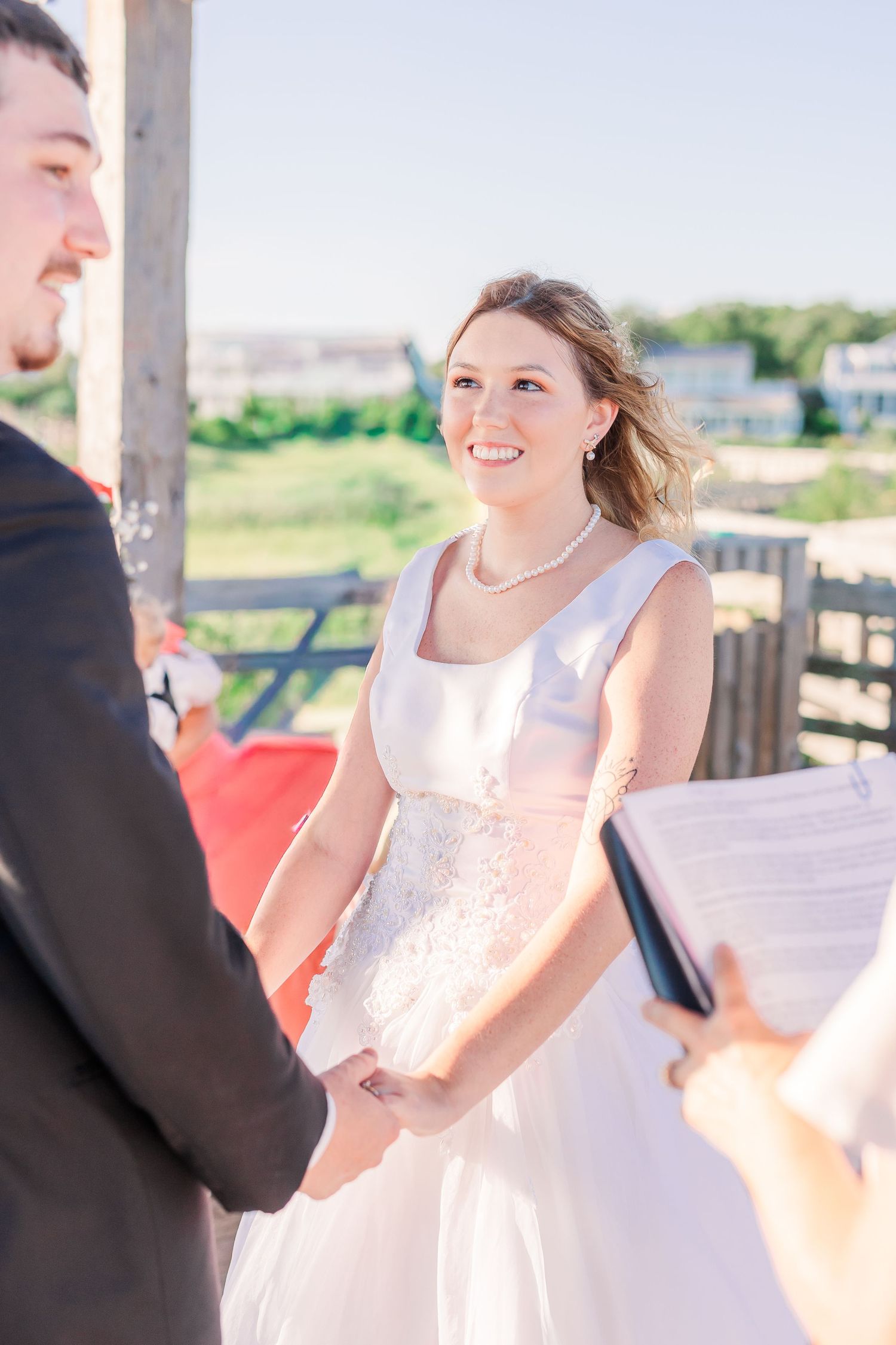 Bride in white dress twirls and dances during outdoor wedding celebration southport elopement wedding bride groom light and airy classic