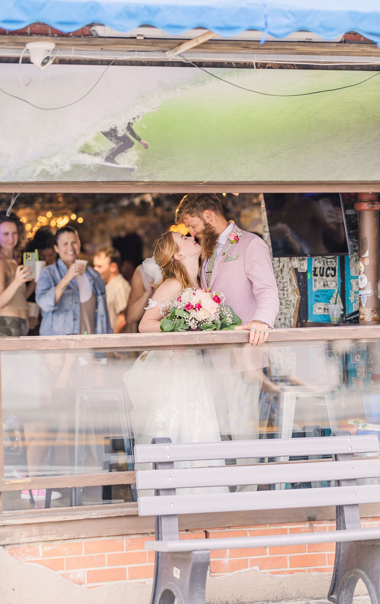 Wrightsville Beach bride and groom in jimmys dive bar embracing in a sweet moment after their wedding in wilmington, nc