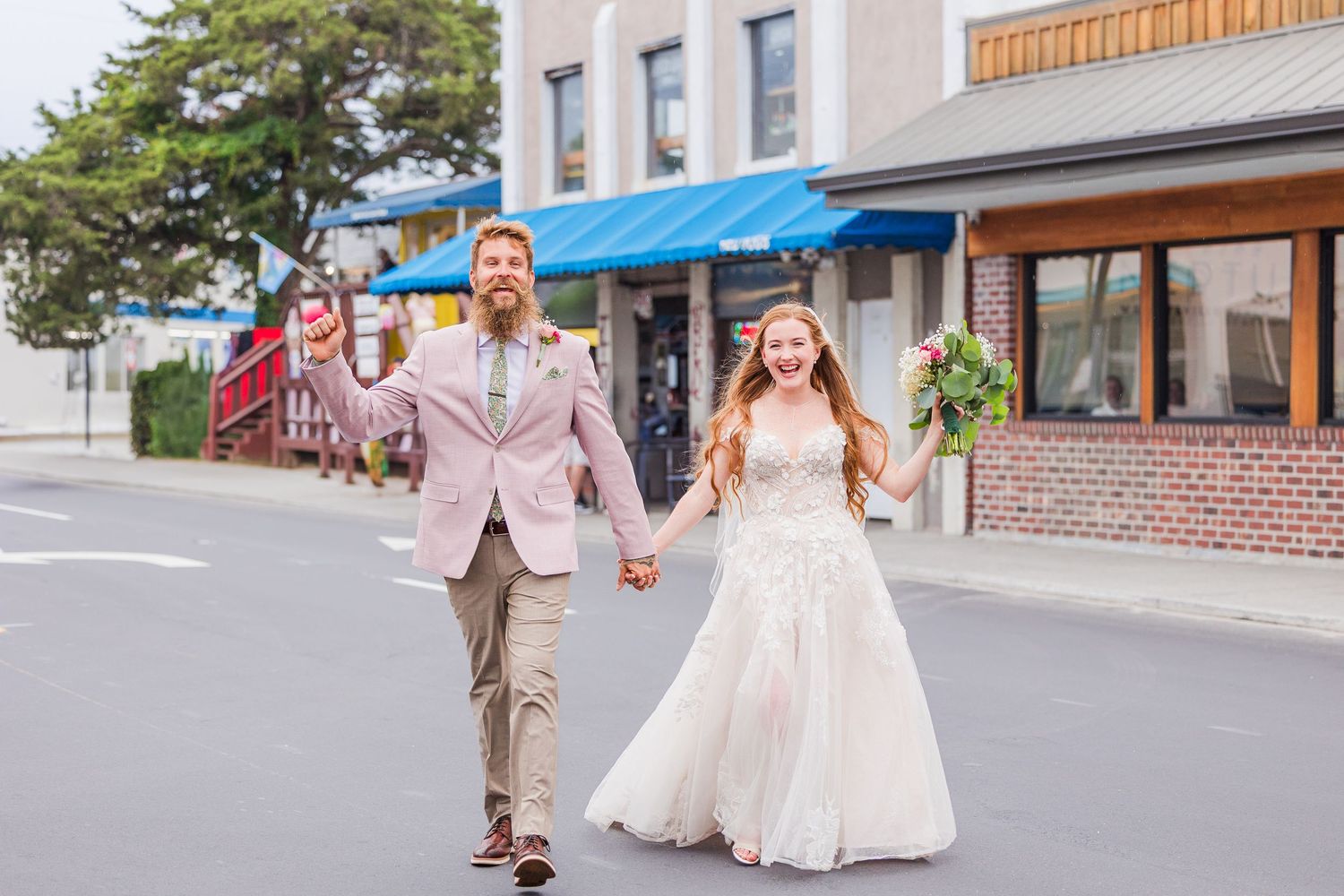 Wrightsville Beach bride and groom in jimmys dive bar crossing the street after their wedding