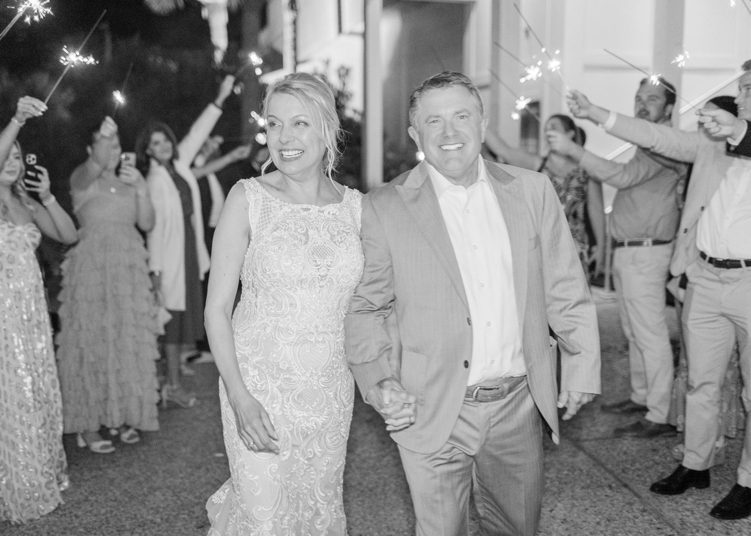 Black and white photos capturing candid dancing moments  landfall wedding bride groom light and airy classic wilmington Wrightsville Beach