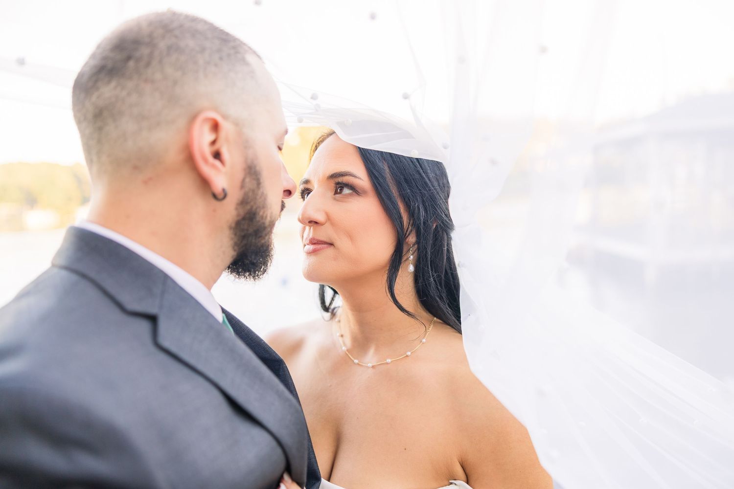 Close-up wedding portraits capturing tender moments between the couple wedding groom bride lake Gaston photographer light airy