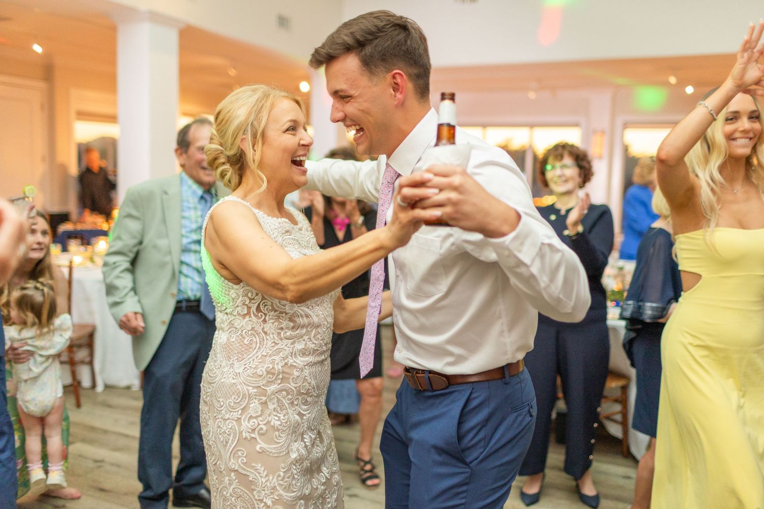 A couple shares an intimate dance moment at their wedding reception.