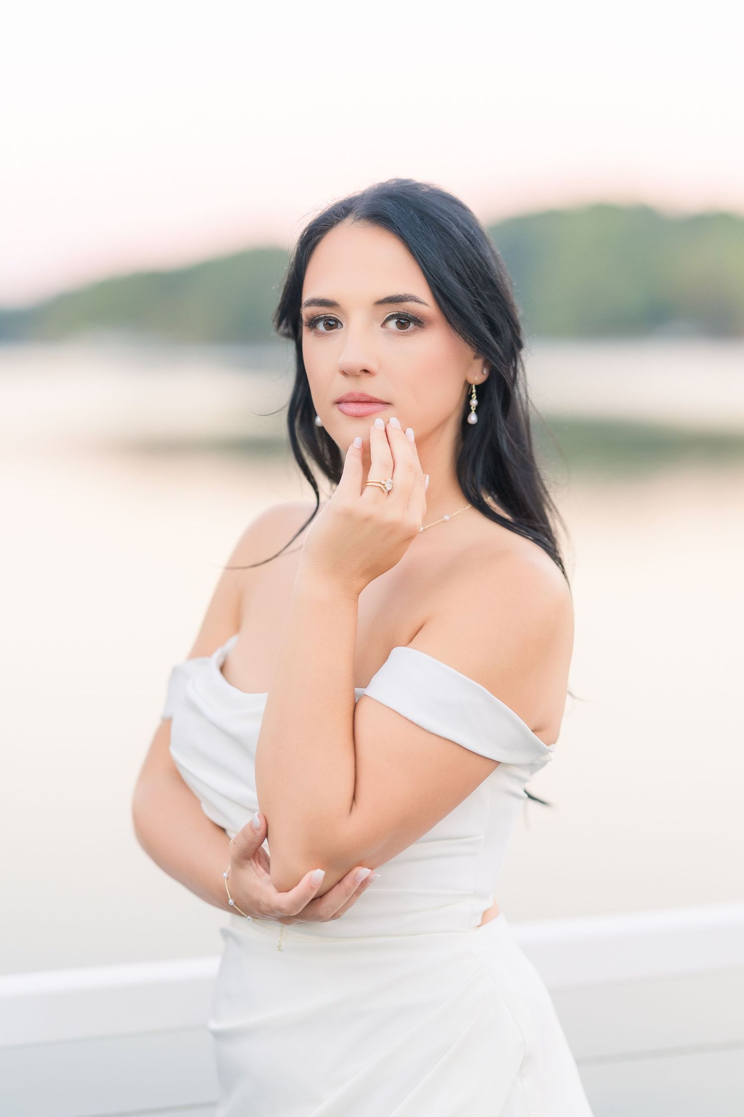 Ethereal bridal portraits in soft white against a dreamy outdoor background wedding groom bride lake Gaston photographer light airy
