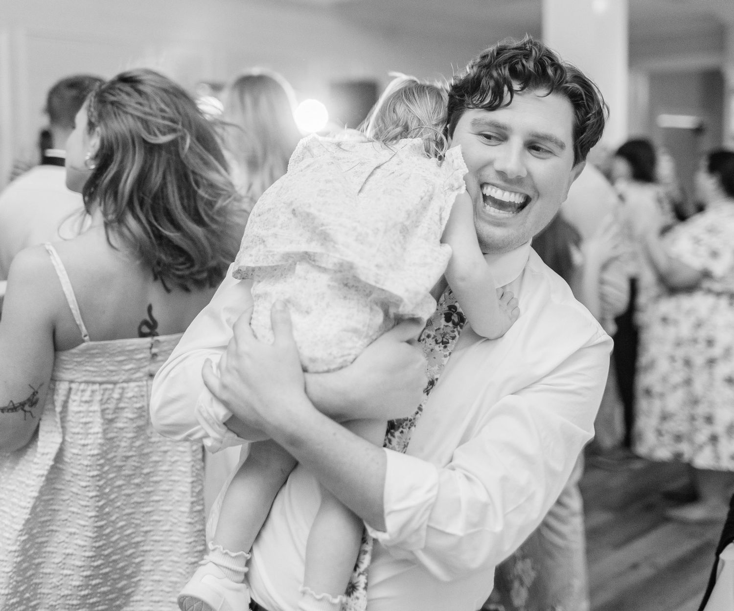 Black and white candid shots of joyful dancing  landfall wedding bride groom light and airy classic wilmington Wrightsville Beach
