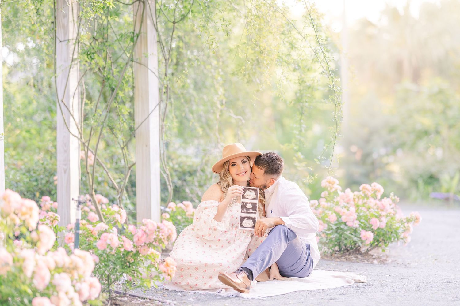 Romantic outdoor portrait session in garden setting with soft natural light.