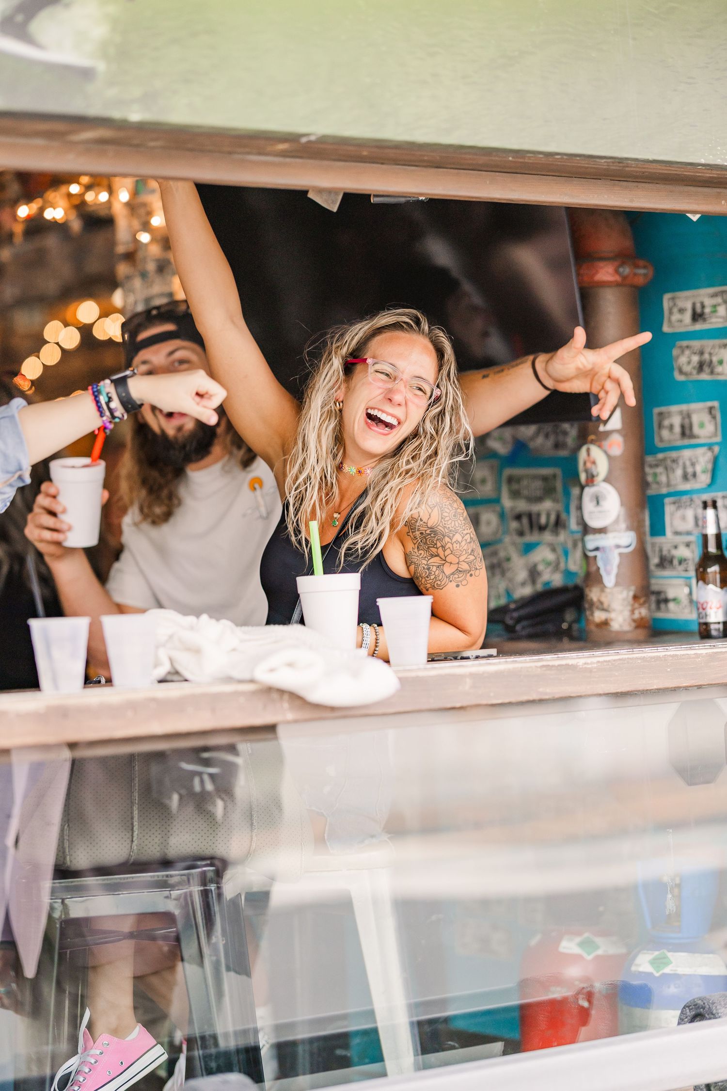 Wrightsville Beach bar patrons at jimmys dive bar congratulate a bride and groom after their wedding