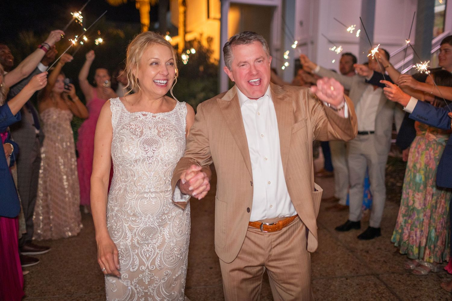 wedding sparkler exit Bluewater landfall wedding bride groom light and airy classic wilmington Wrightsville Beach