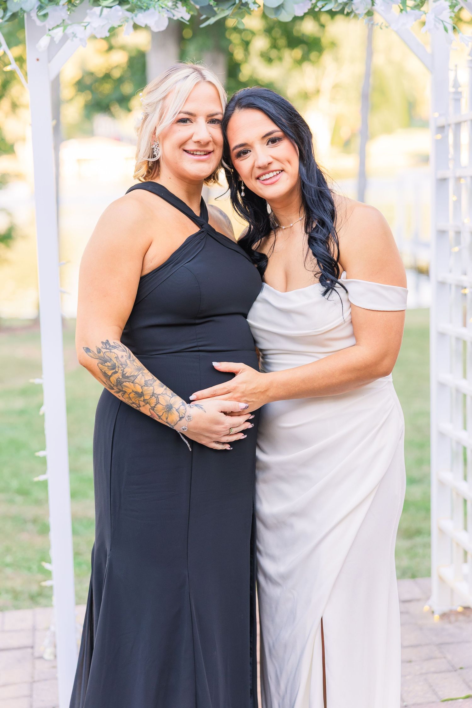 Wedding party members in navy and white dresses posing together outdoors wedding groom bride lake Gaston photographer light airy